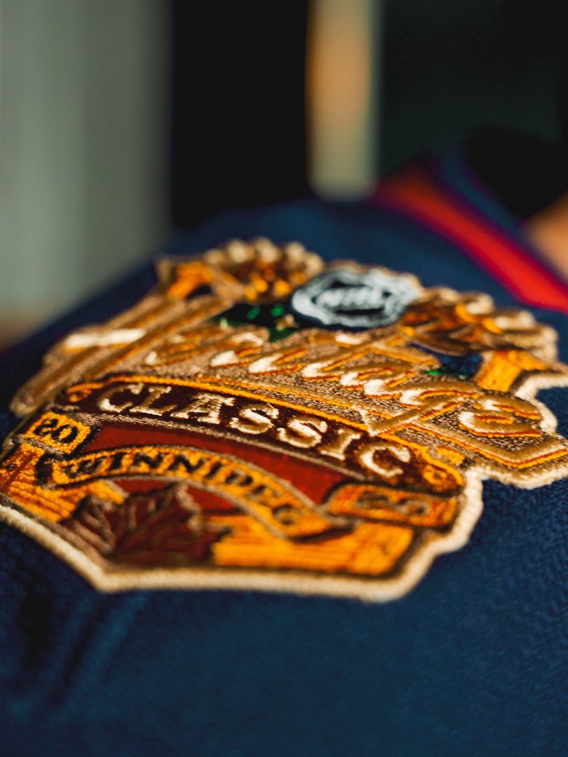 Close-up of the 2026 NHL Heritage Classic Winnipeg event patch on the shoulder of the sweater