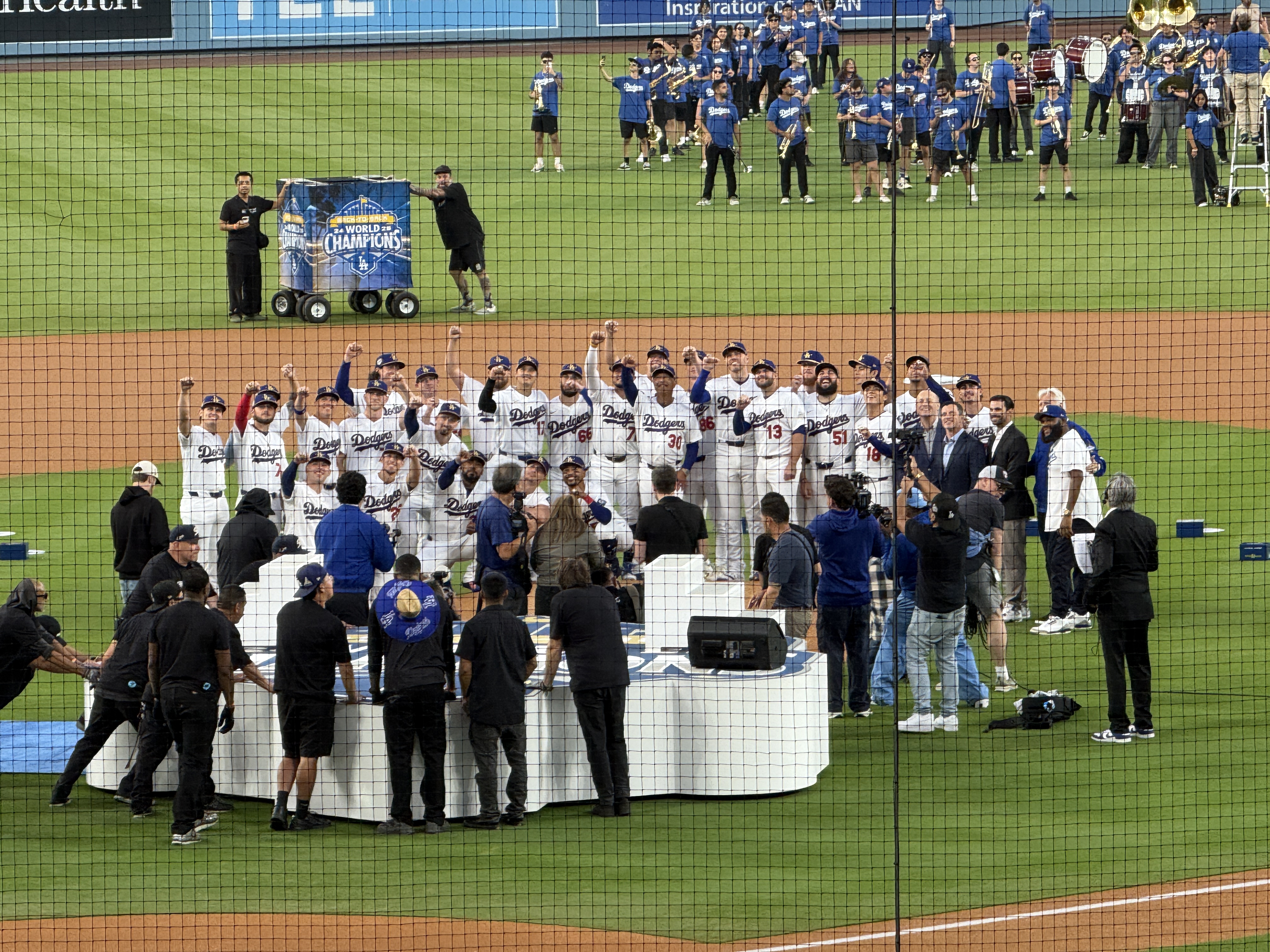 Dodgers players gathered on the field during the 2026 World Series ring ceremony
