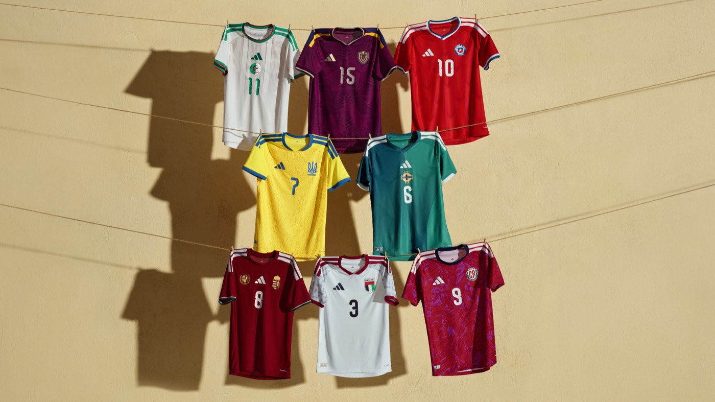 Adidas 2026 World Cup home kits on a clothesline including Algeria, Chile, Ukraine, Northern Ireland, Hungary, and Venezuela