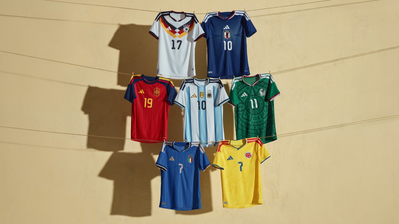 Adidas 2026 World Cup home kits on a clothesline including Germany, Japan, Spain, Argentina, Mexico, and Colombia