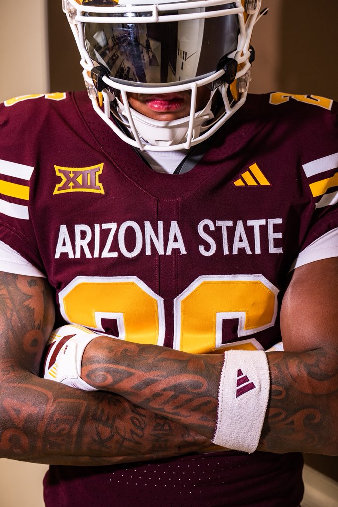 Close up of the Arizona State 2026 throwback jersey chest, showing ARIZONA STATE in white block letters above gold numbers outlined in white, with the Big 12 patch and the adidas three stripe mark on the shoulders