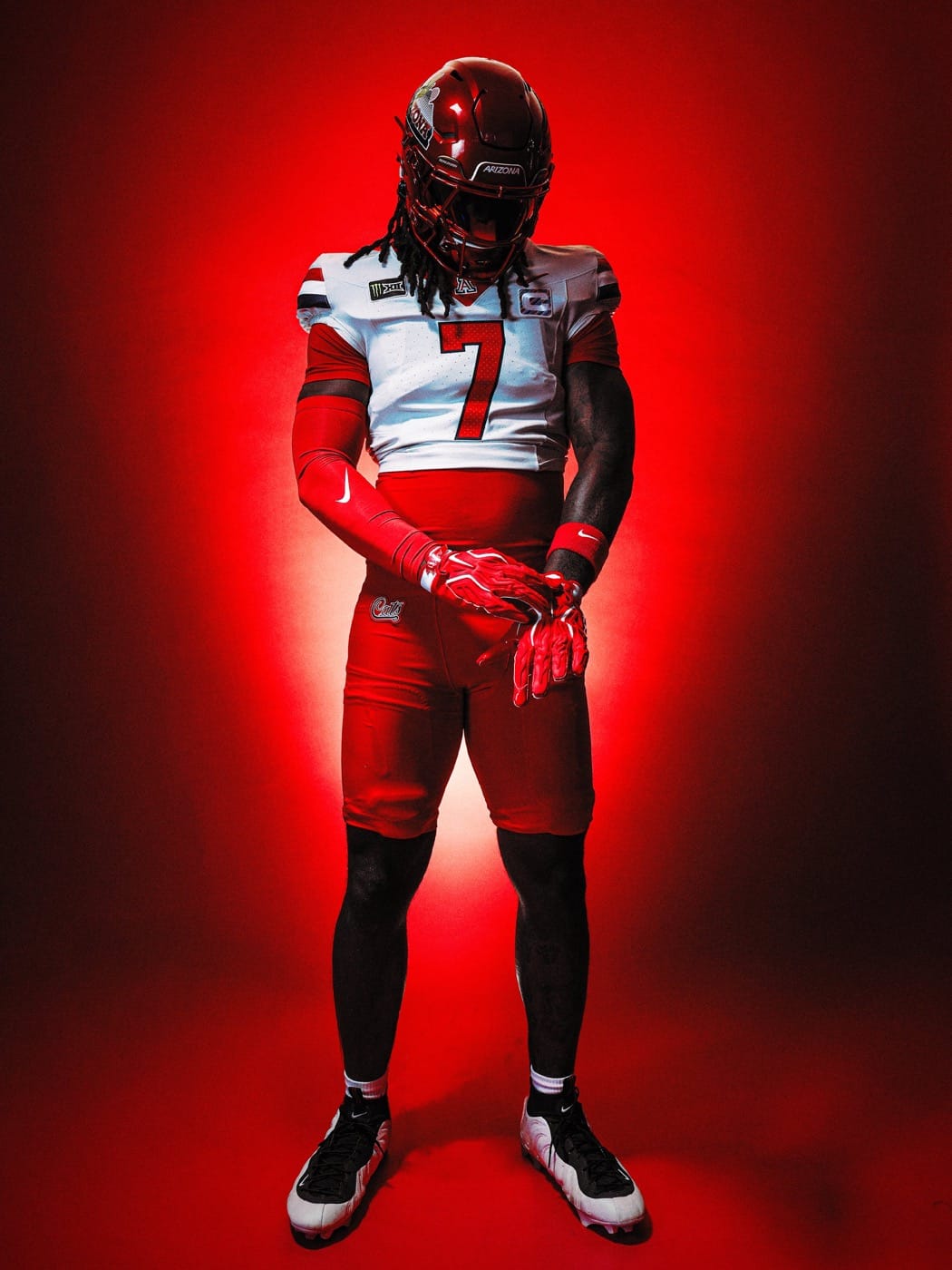 Arizona Sandstorm uniform at West Virginia 2026: red chrome helmet, white jersey with red 7, red pants