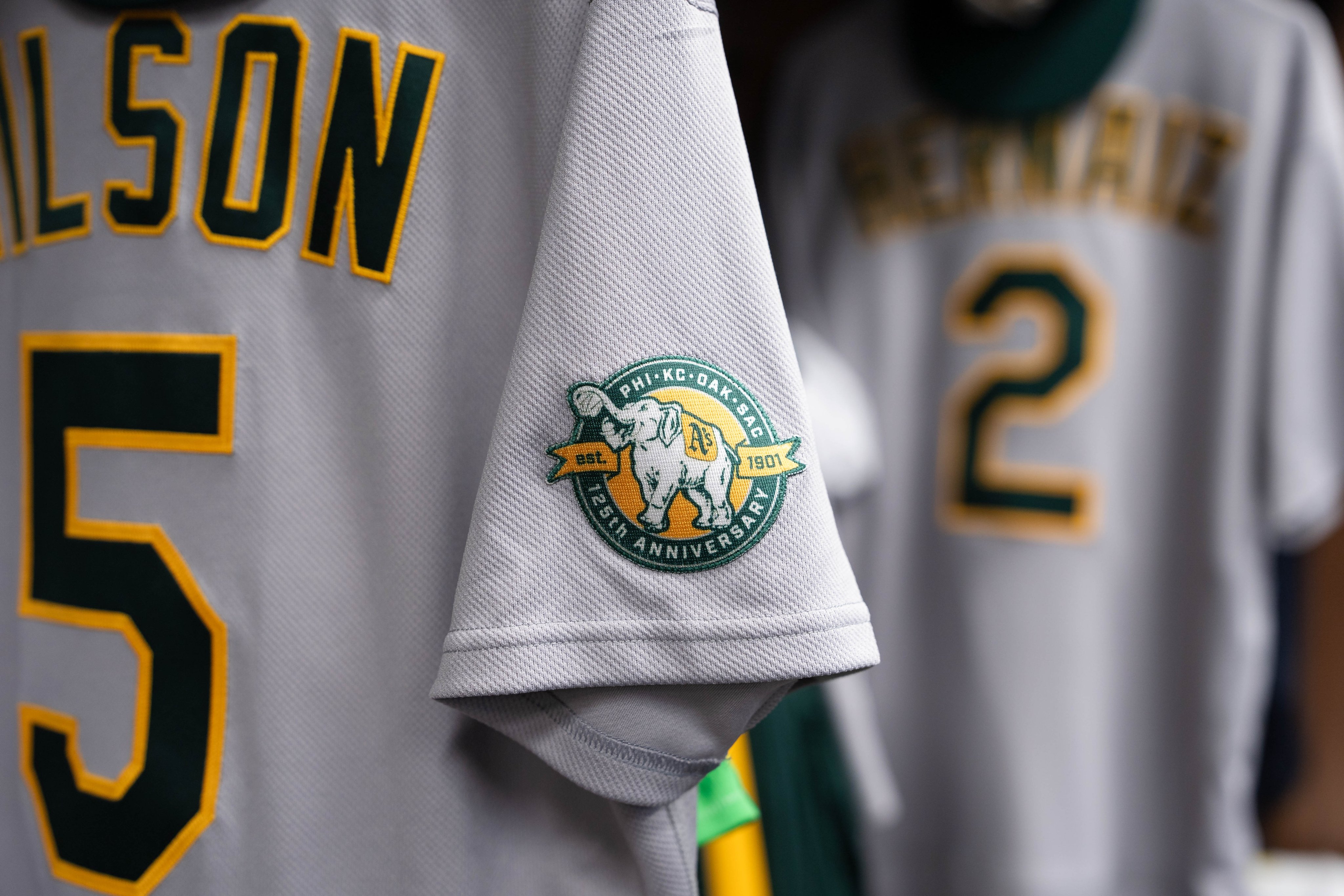 Athletics 125th anniversary sleeve patch with elephant logo showing PHI KC OAK SAC