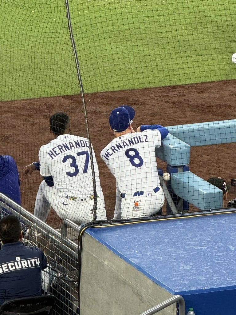 Teoscar Hernandez number 37 and Kike Hernandez number 8 of the Los Angeles Dodgers in home white jerseys at the dugout rail during NLDS Game 2 on October 4 2026