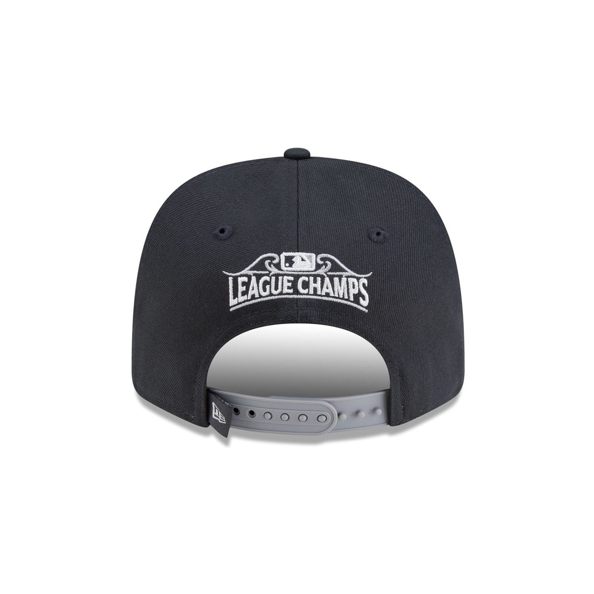 Back of the Milwaukee Brewers 2026 New Era locker room 9SEVENTY hat with a white League Champs wordmark under the MLB logo inside gray scrollwork above a gray stretch-snap strap