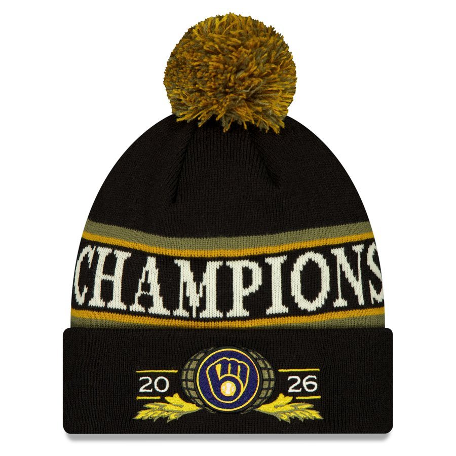 New Era Milwaukee Brewers 2026 World Series Champions locker room cuffed knit hat in black with a gold and olive pom, Champions knit in cream with gold stripes, and the ball-in-glove on a globe between 20 and 26
