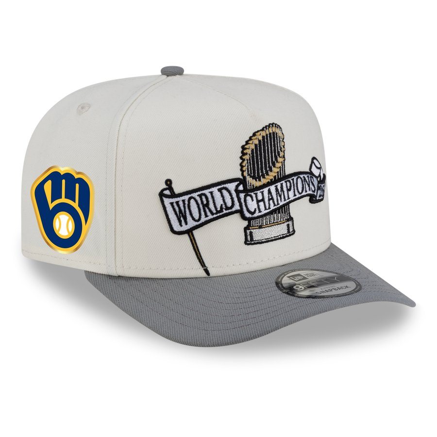 New Era Milwaukee Brewers 2026 World Series Champions Parade 9FIFTY A-Frame snapback in cream with a gray brim, the ball-in-glove patch on the front left and an embroidered Commissioner's Trophy with a World Champions banner