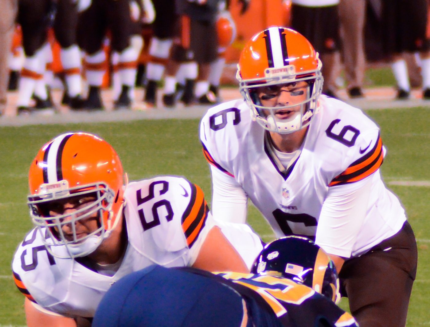 Browns center Alex Mack and quarterback Brian Hoyer in white jerseys, brown pants and orange helmets, August 23, 2014