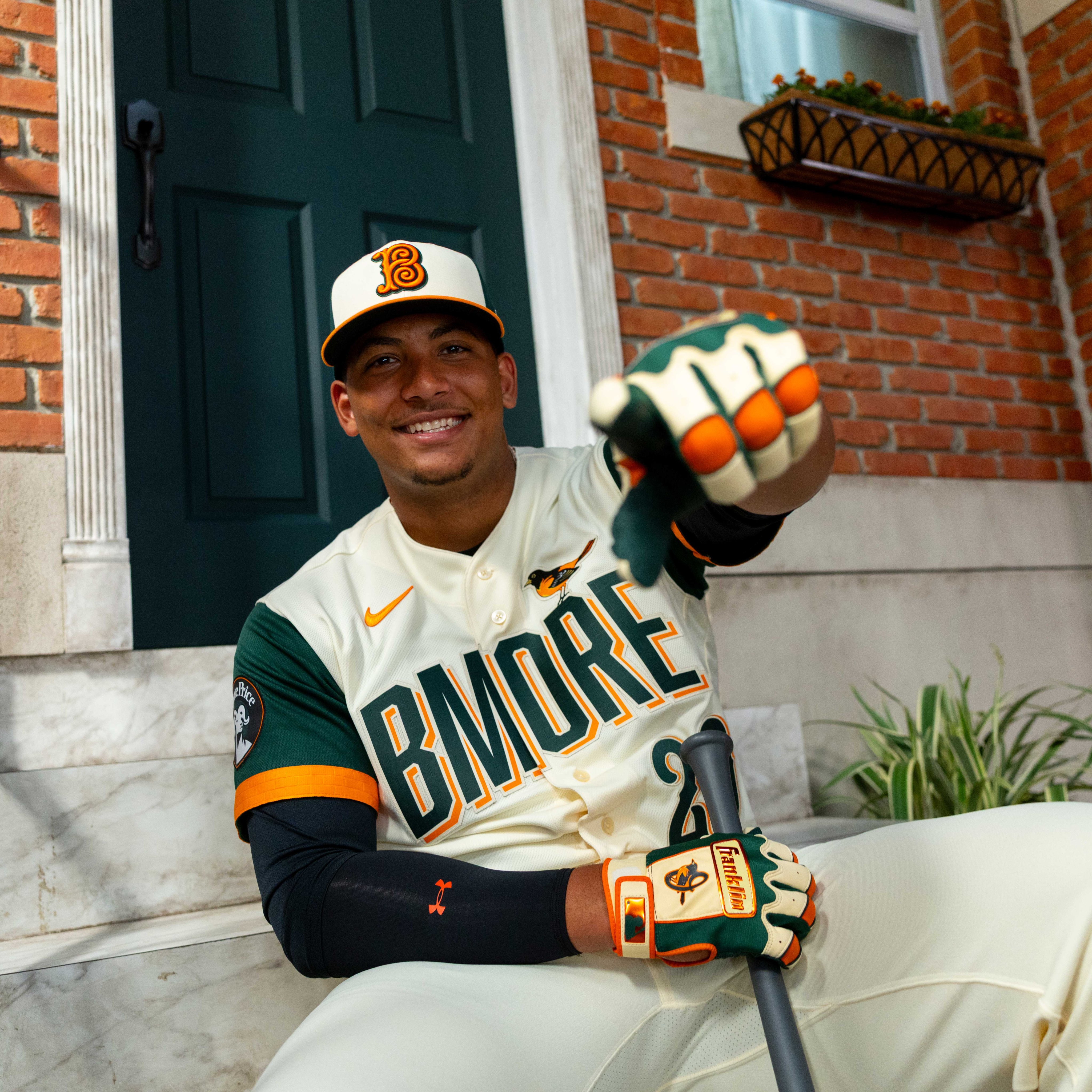 Baltimore Orioles 2026 BMORE City Connect jersey player on stoop with bat