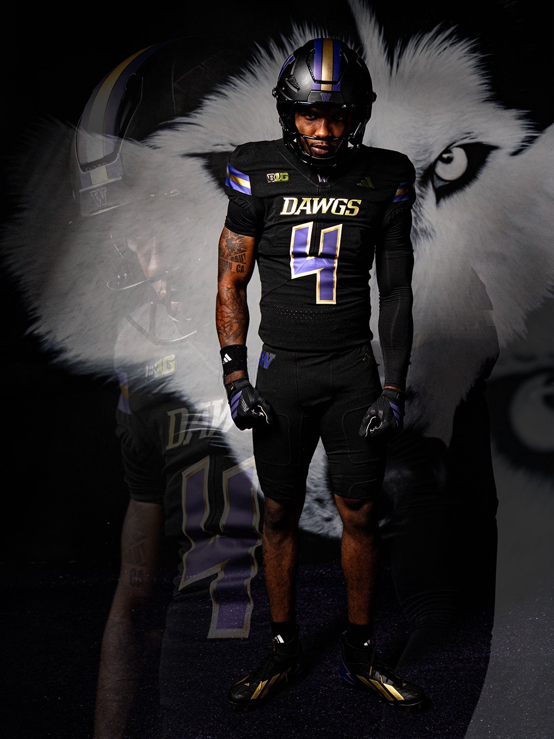 Washington Huskies 2026 all-black alternate uniform in full, black helmet with purple and gold stripe, black jersey with DAWGS in gold and a purple number 4, and black pants