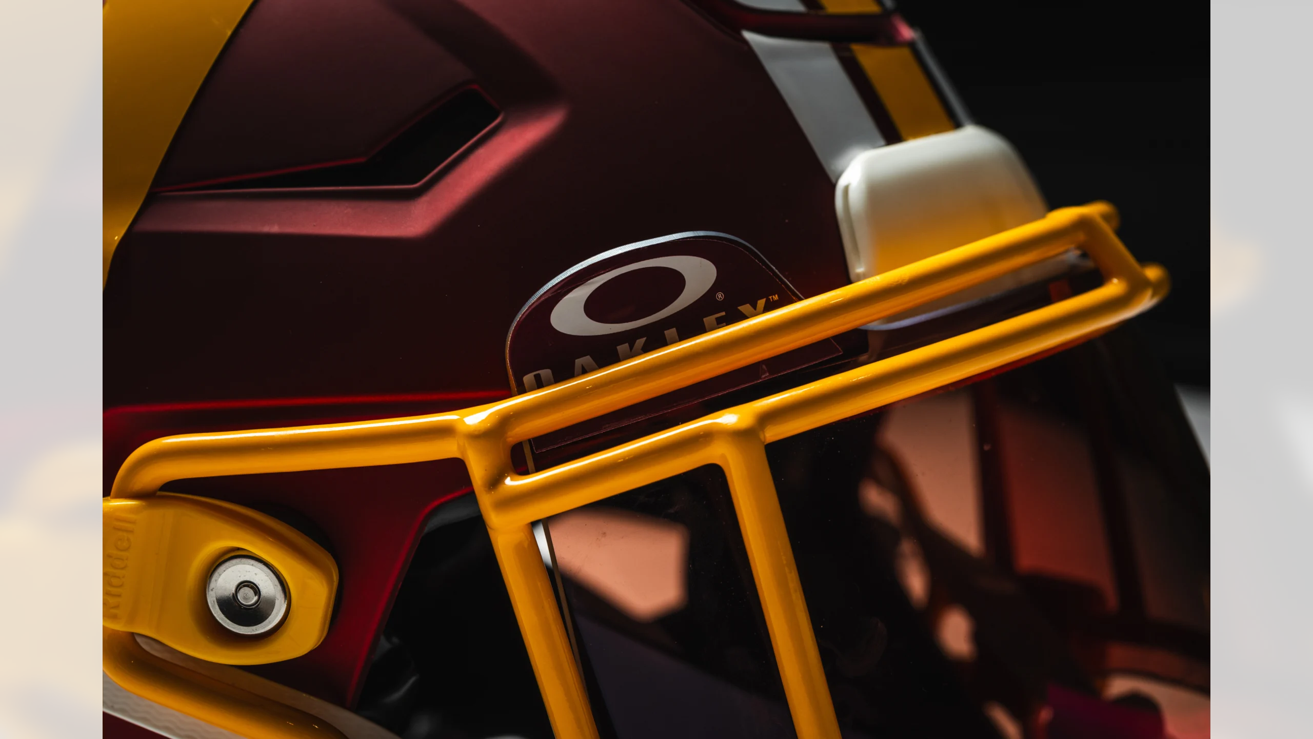 Close-up of Washington Commanders burgundy helmet with gold facemask