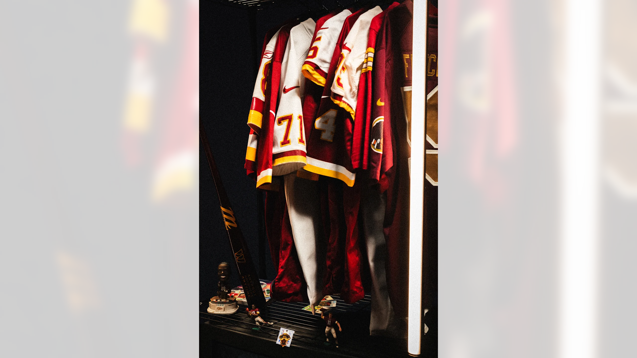 Washington Commanders throwback jerseys hanging in locker room
