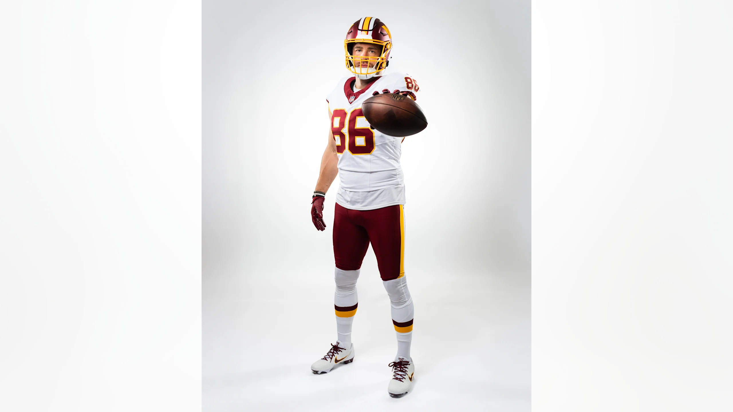 Washington Commanders player number 86 in throwback white away uniform