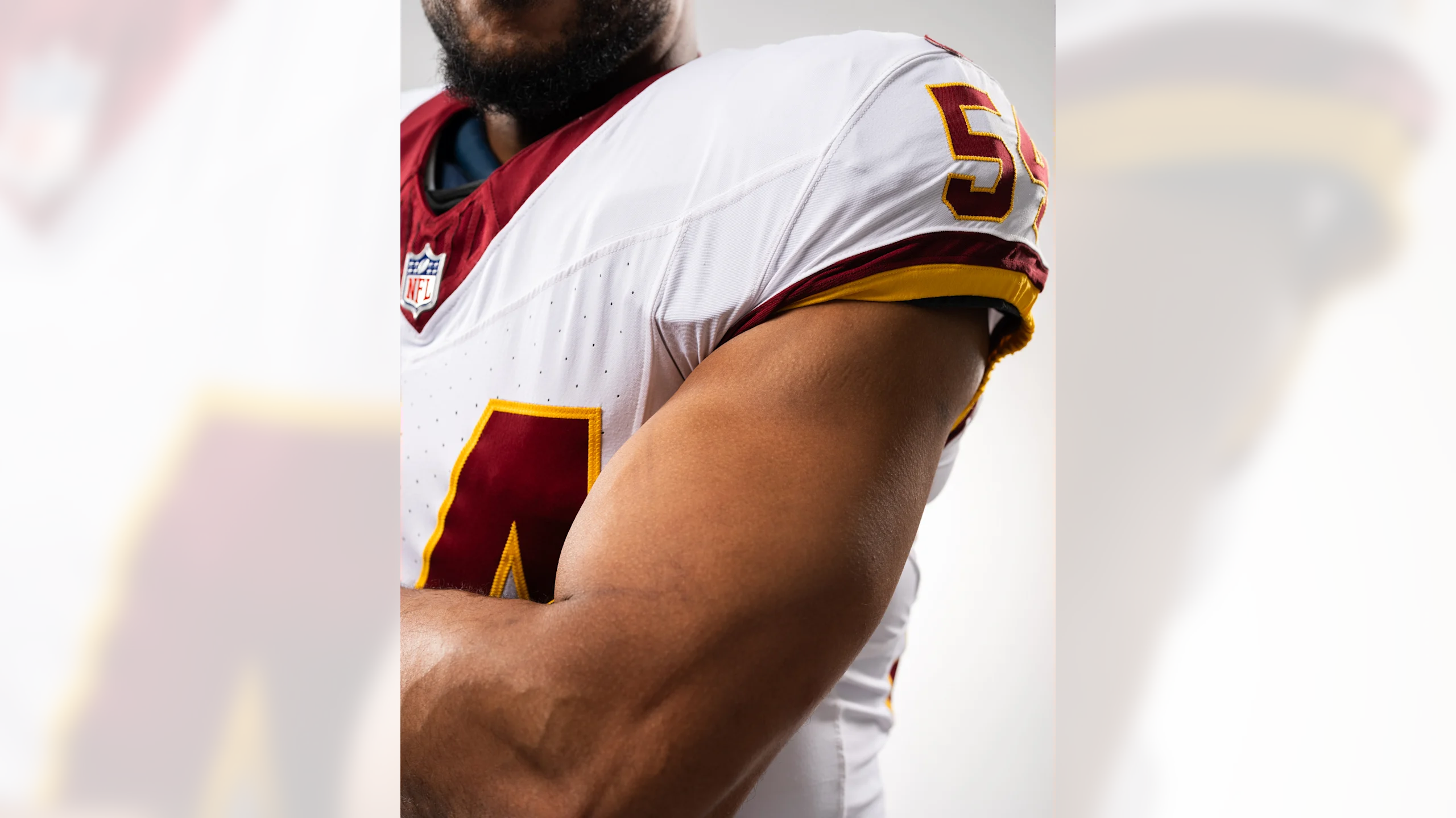 Close-up of Washington Commanders throwback jersey sleeve striping detail