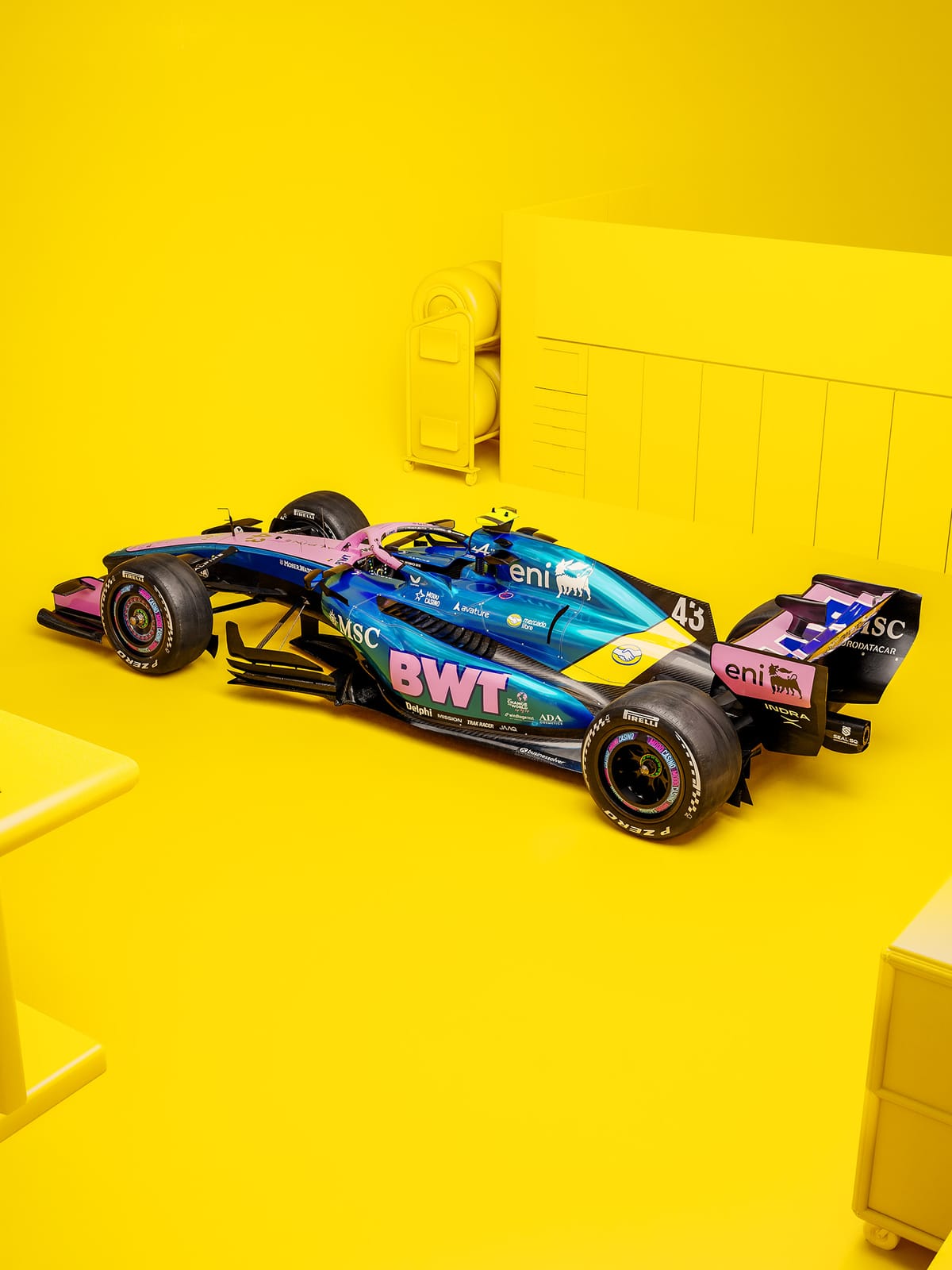 Alpine F1 Miami Grand Prix 2026 Argentinian twist photoshoot front three quarter angle of Franco Colapinto number 43 car on yellow background with BWT pink and Alpine blue base livery
