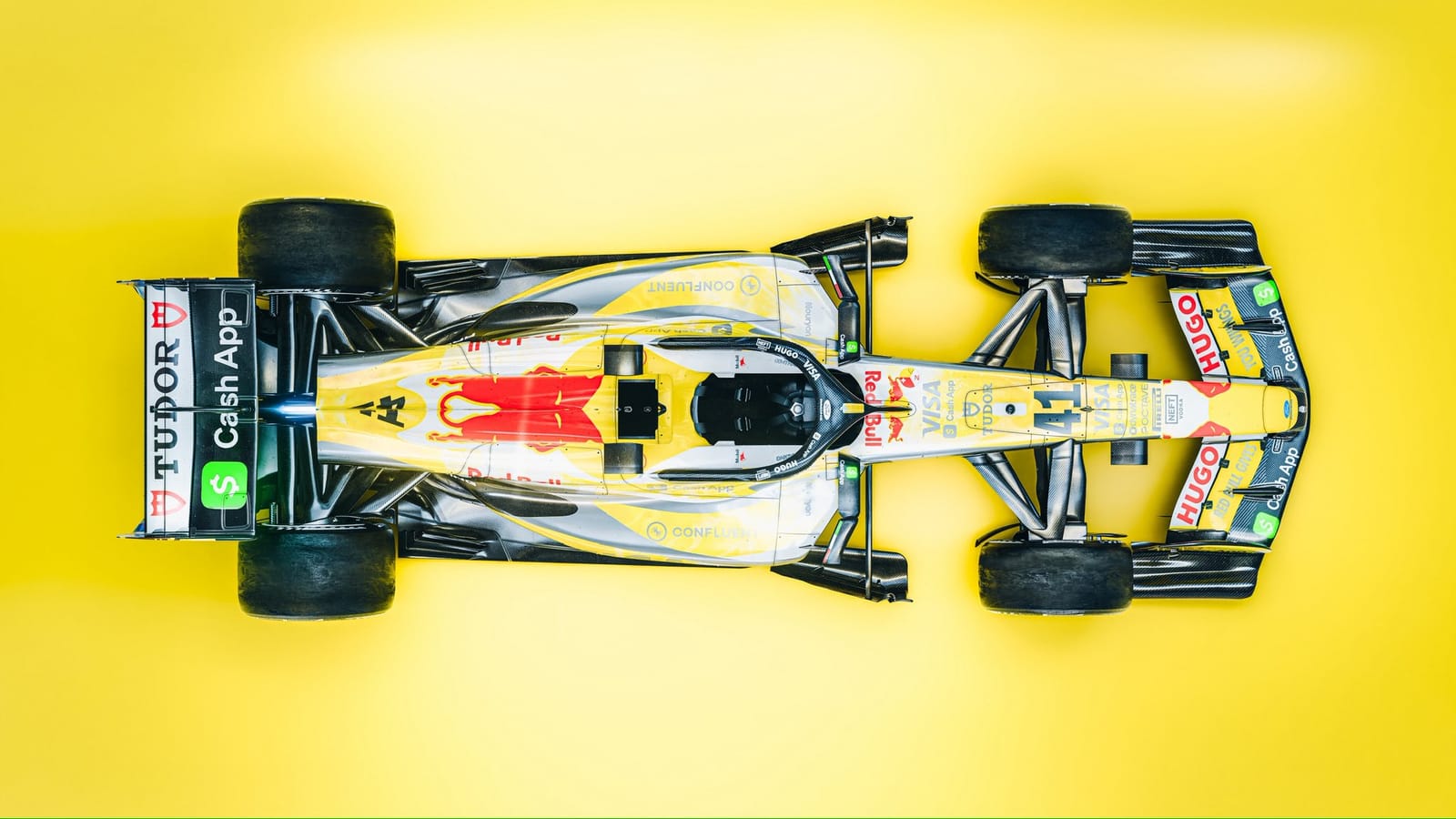 Visa Cash App RB Summer Edition Miami GP 2026 yellow livery overhead top-down view of the chassis showing the full deep summer-sun yellow repaint with Red Bull Visa Cash App and Tudor branding visible from above