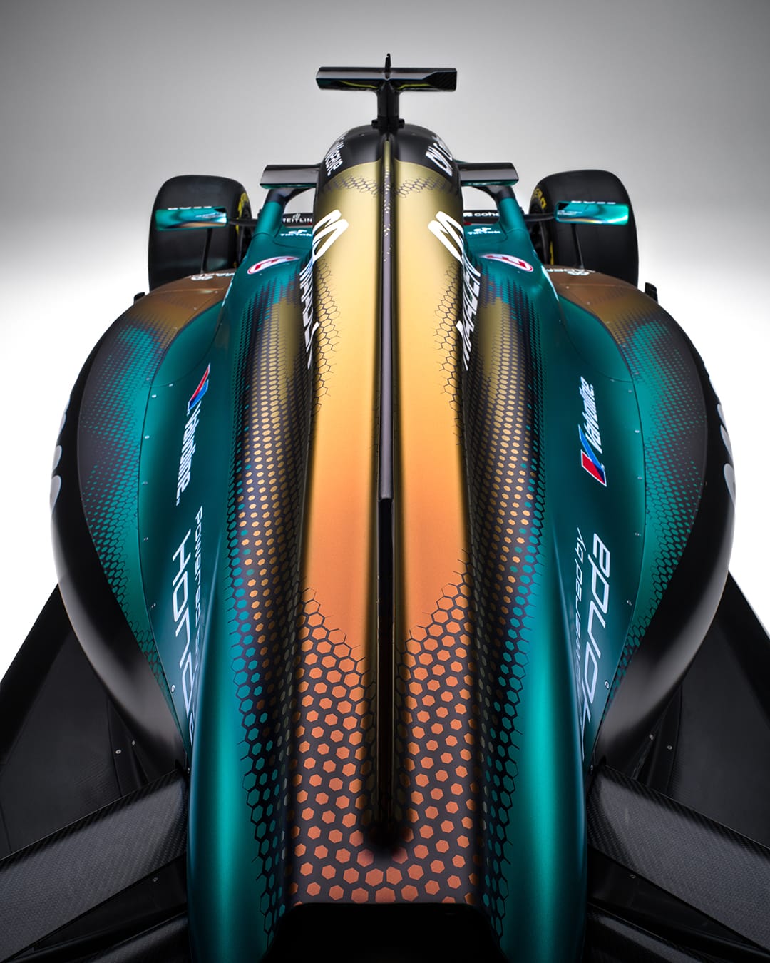 Aston Martin AMR25 F1 Monaco Grand Prix 2026 Maaden iridescent livery alternate studio angle of the full chassis showing the iridescent gradient across the entire body work with the Coinbase rear wing detail visible