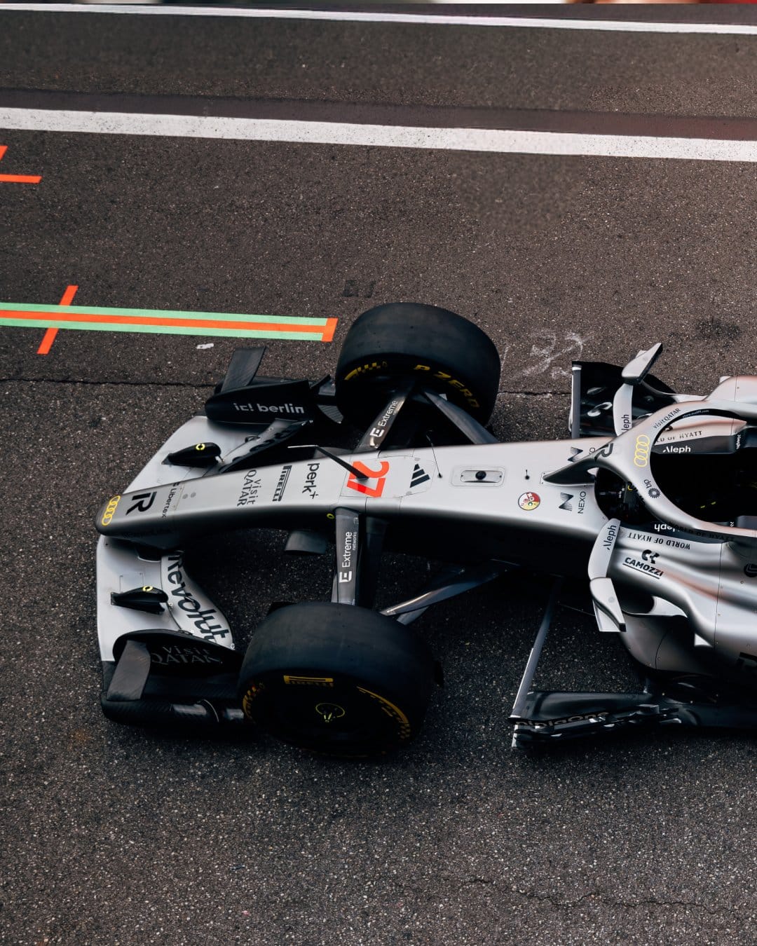 Audi F1 2026 Monaco Grand Prix overhead chassis view showing the standard sponsor identity placement and the Nuvolari tribute yellow accent details across the carbon body