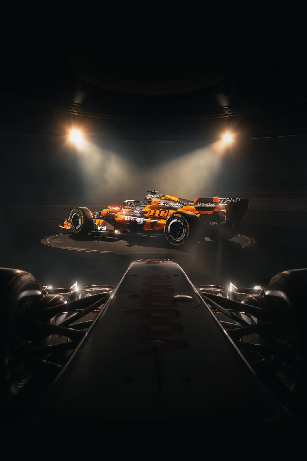 McLaren F1 Monaco Grand Prix 2026 special livery alternate front three-quarter angle of the MCL40 showing the chassis silhouette and the throwback color treatment under studio spotlights