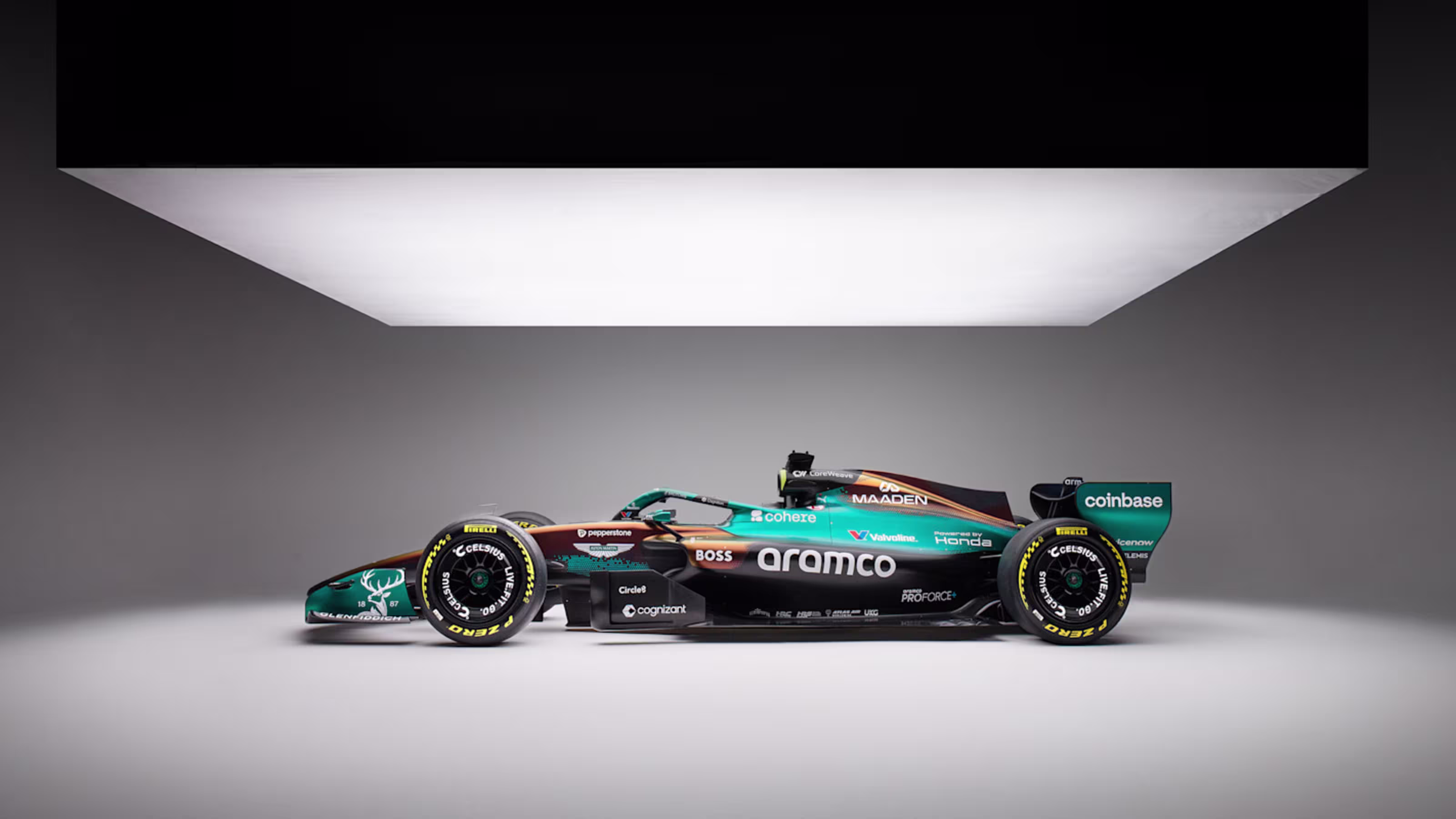 Aston Martin AMR25 F1 Monaco Grand Prix 2026 Maaden iridescent livery official main studio photography 28x16 wide format shot of the chassis showing the full iridescent color-changing paint scheme and the Maaden partnership branding