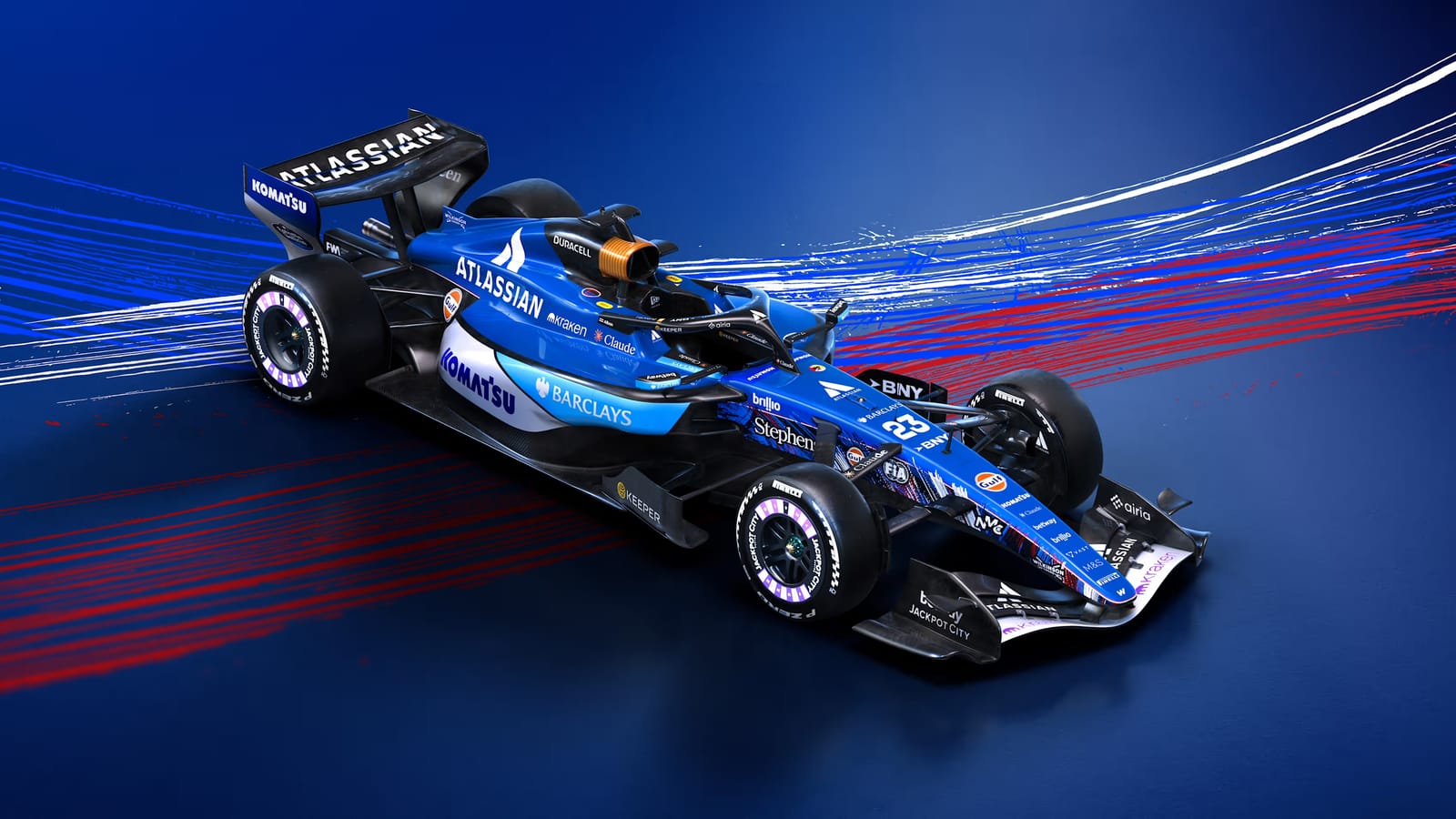 Atlassian Williams F1 2026 British Grand Prix Silverstone livery front three-quarter studio shot showing the blue car with light-blue lower flanks and red-and-blue airflow streamlines in the background