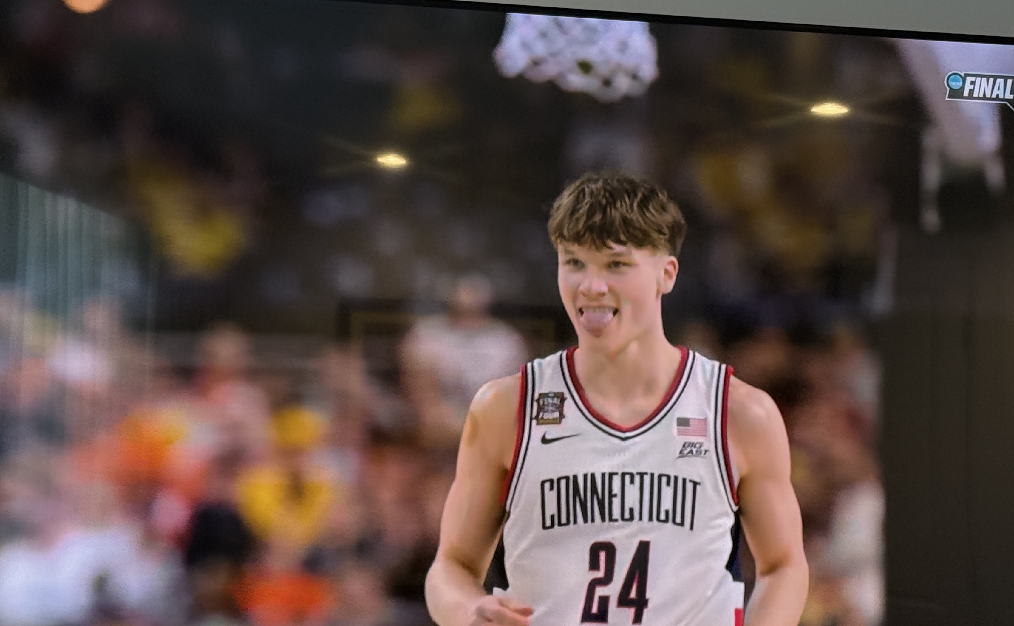 UConn player in white jersey