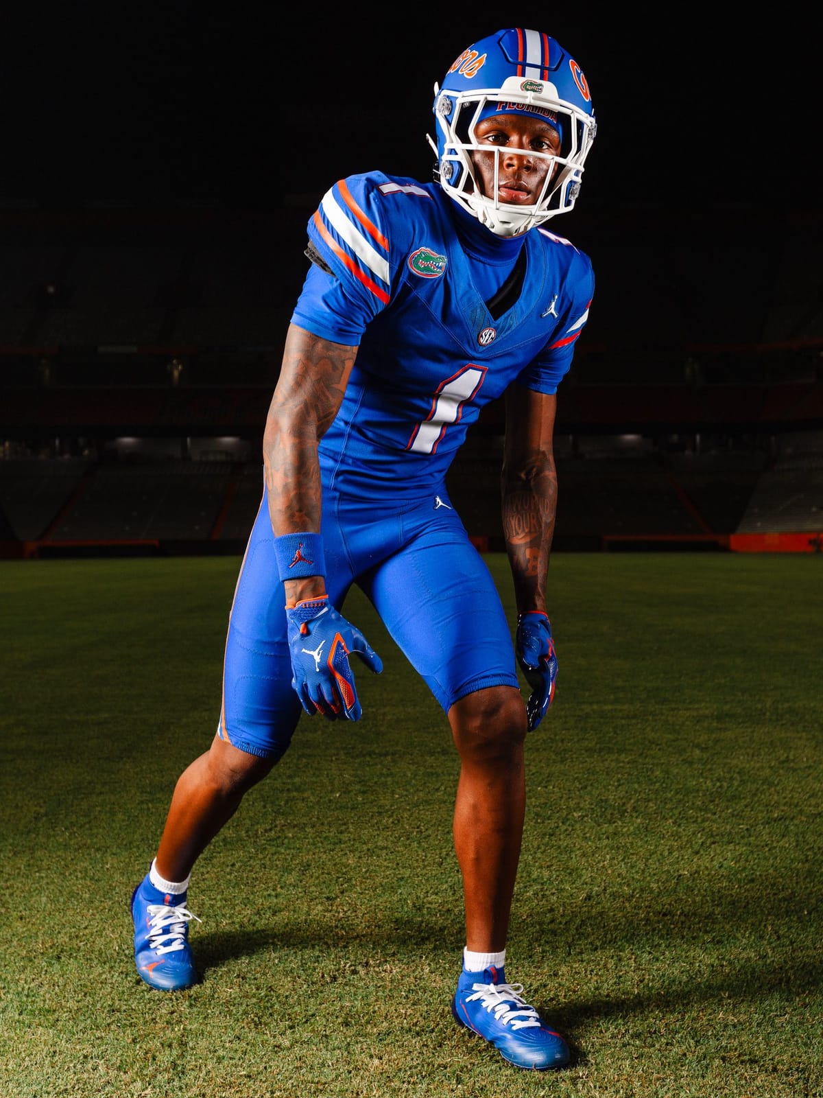 Full-length view of the Florida Gators all-blue uniform combination of blue helmet, blue jersey and blue pants, with orange and white accents