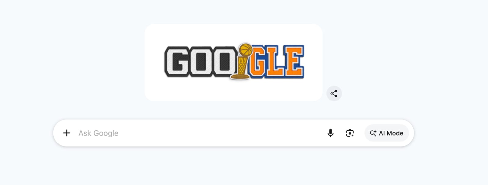 Google 2026 NBA Finals Doodle in the Google search bar splitting the Google logo between GOO in San Antonio Spurs Icon Edition black-and-silver jersey wordmark style with white block letters on black with blue trim outlines and GLE in New York Knicks Icon Edition orange-and-blue jersey wordmark style with orange block letters and blue trim, the second O replaced with the Larry O'Brien Trophy in gold and silver with a basketball going through an orange basketball net at the top of the trophy