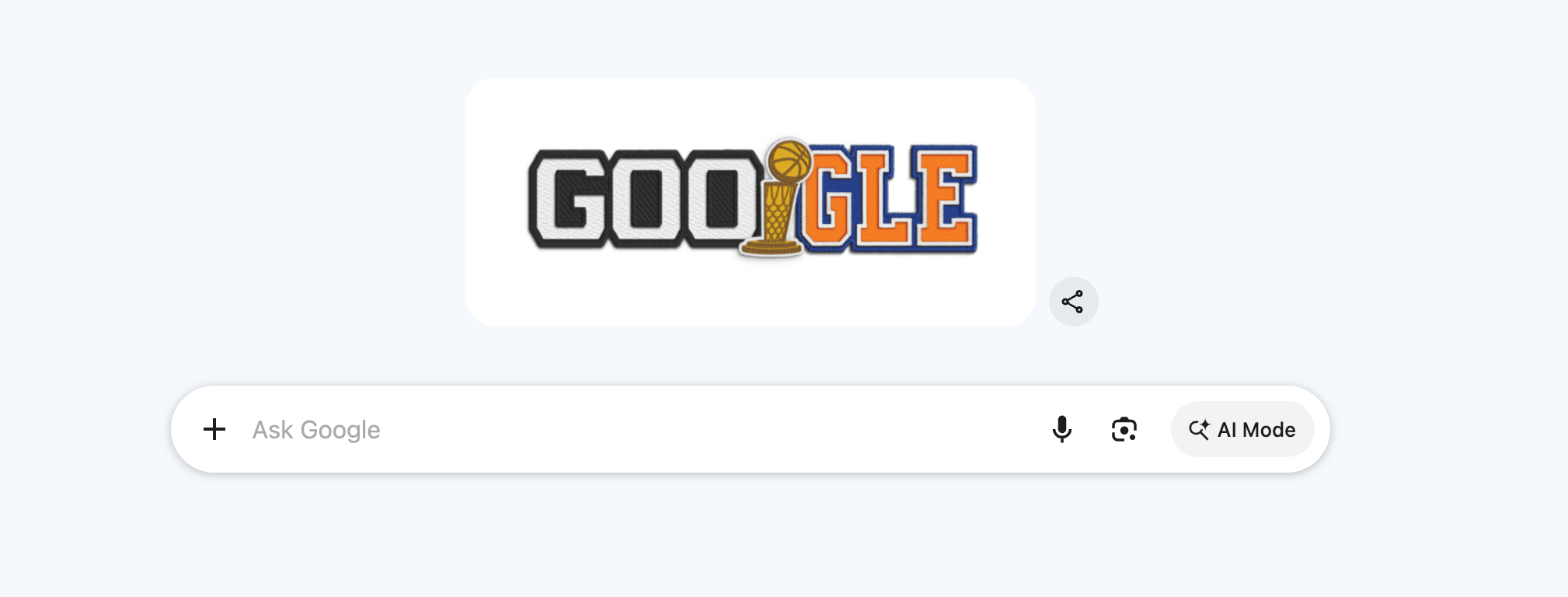 Google 2026 NBA Finals Doodle in the Google search bar splitting the Google logo between GOO in San Antonio Spurs Icon Edition black-and-silver jersey wordmark style with white block letters on black with blue trim outlines and GLE in New York Knicks Icon Edition orange-and-blue jersey wordmark style with orange block letters and blue trim, the second O replaced with the Larry O'Brien Trophy in gold and silver with a basketball going through an orange basketball net at the top of the trophy