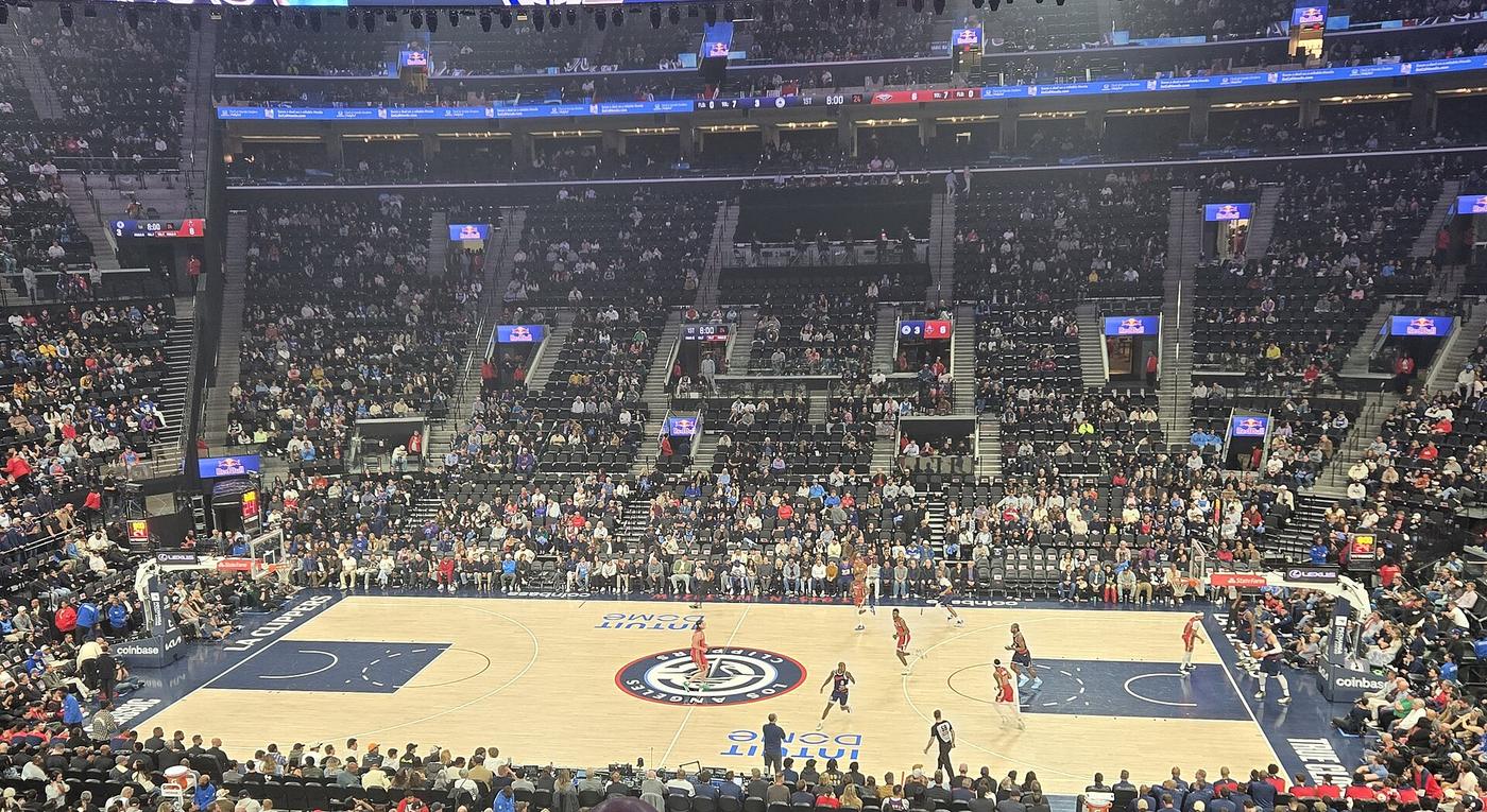 The Clippers court at Intuit Dome in Inglewood, Calif., with the round ship-and-compass logo at center court during a game in April 2025