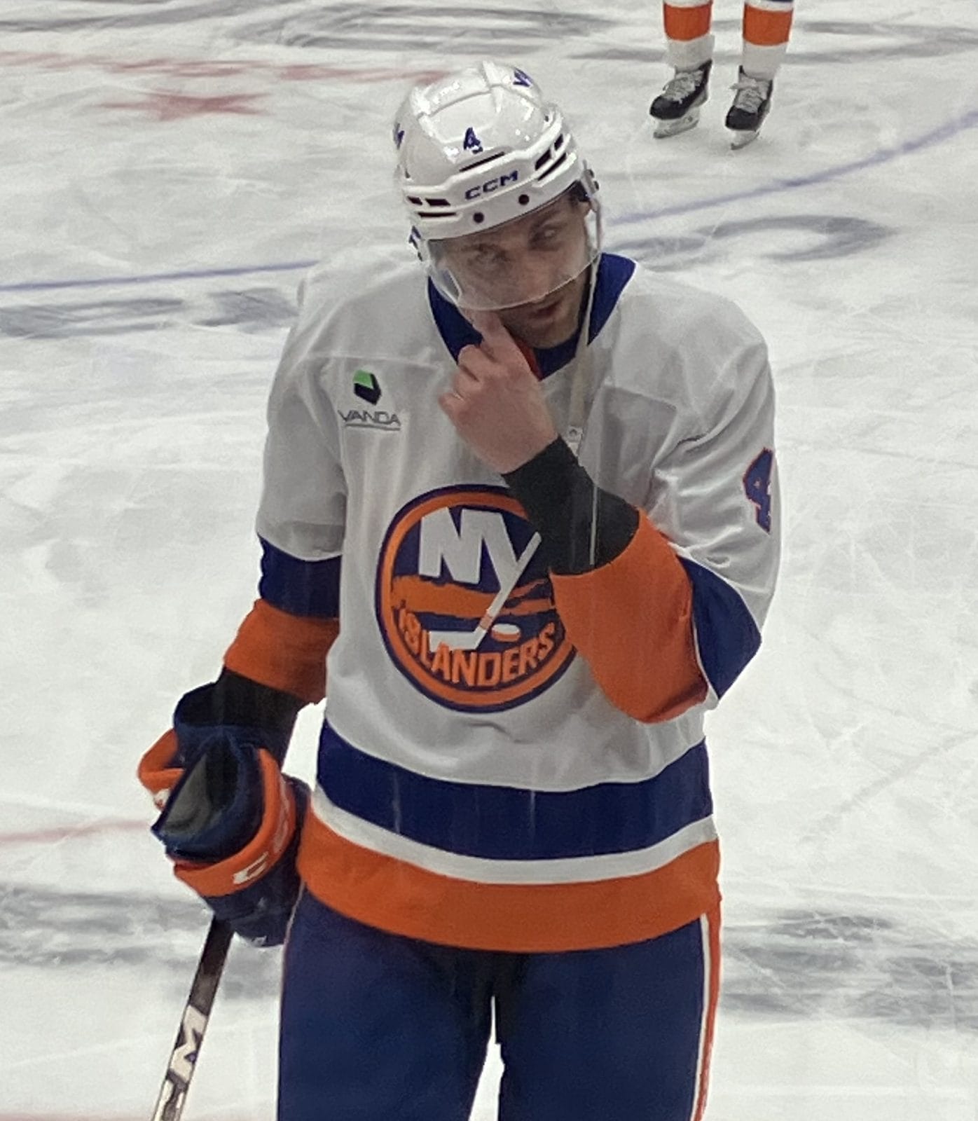 Islanders defenseman Carson Soucy in the white jersey, showing the NY logo with the hockey-stick Y and the map of Long Island, during warmups on Feb. 2, 2026
