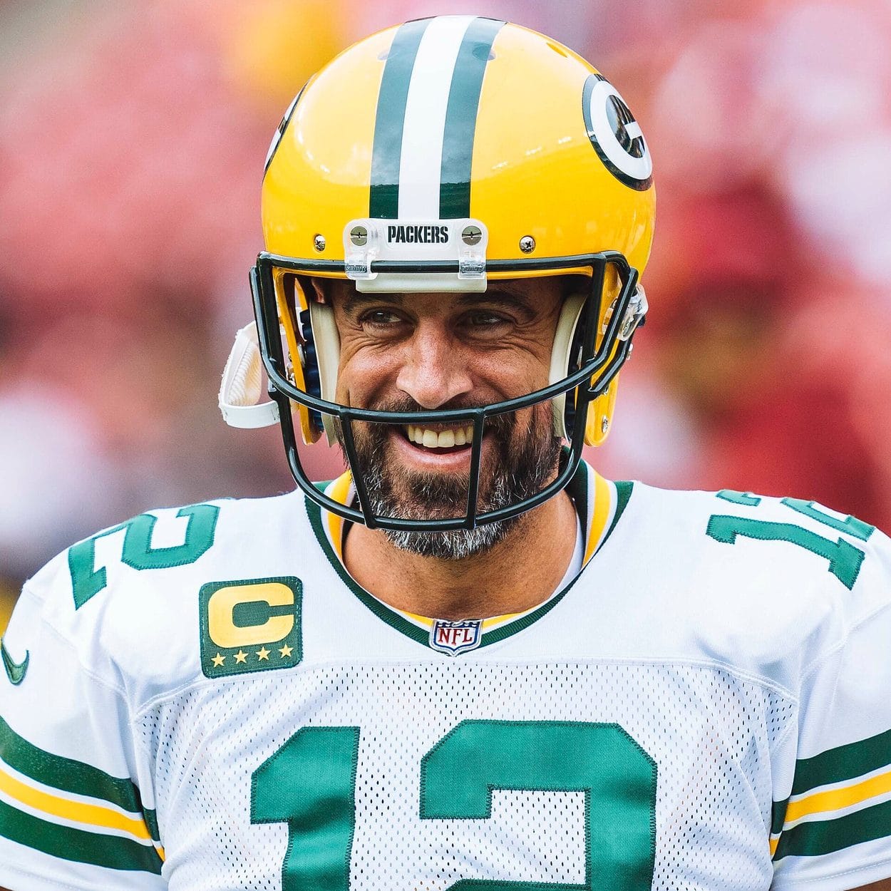 Packers quarterback Aaron Rodgers in the gold helmet with the green and white G logo, against Washington at FedEx Field on Oct. 23, 2022