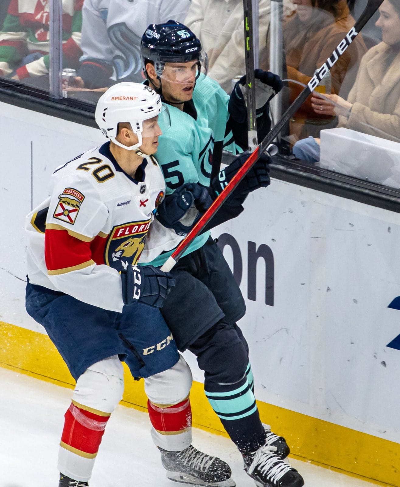 A Panthers player in the white road jersey with the shield-shaped panther crest, against the Kraken in Seattle on Dec. 3, 2022