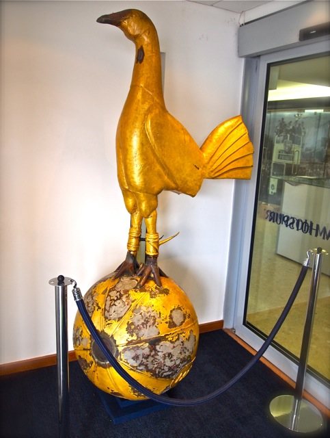 The original Tottenham Hotspur bronze cockerel standing on a ball, cast by former player William James Scott for the roof of White Hart Lane, on display indoors in 2011