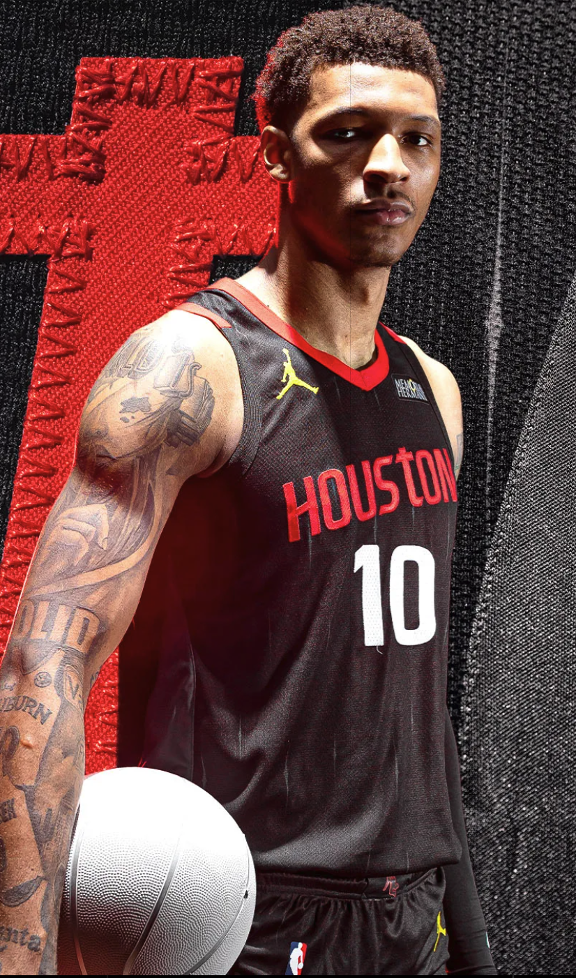 Houston Rockets 2026-27 Statement Edition black alternate jersey worn by Jabari Smith Jr. number 10, with red HOUSTON wordmark, Championship Yellow Jumpman logo at the hem, and the spacesuit-inspired Commander Stripe visible behind the player
