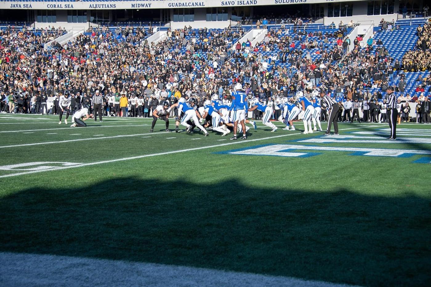 Duke in royal blue jerseys lined up against UCF at the 2022 Military Bowl