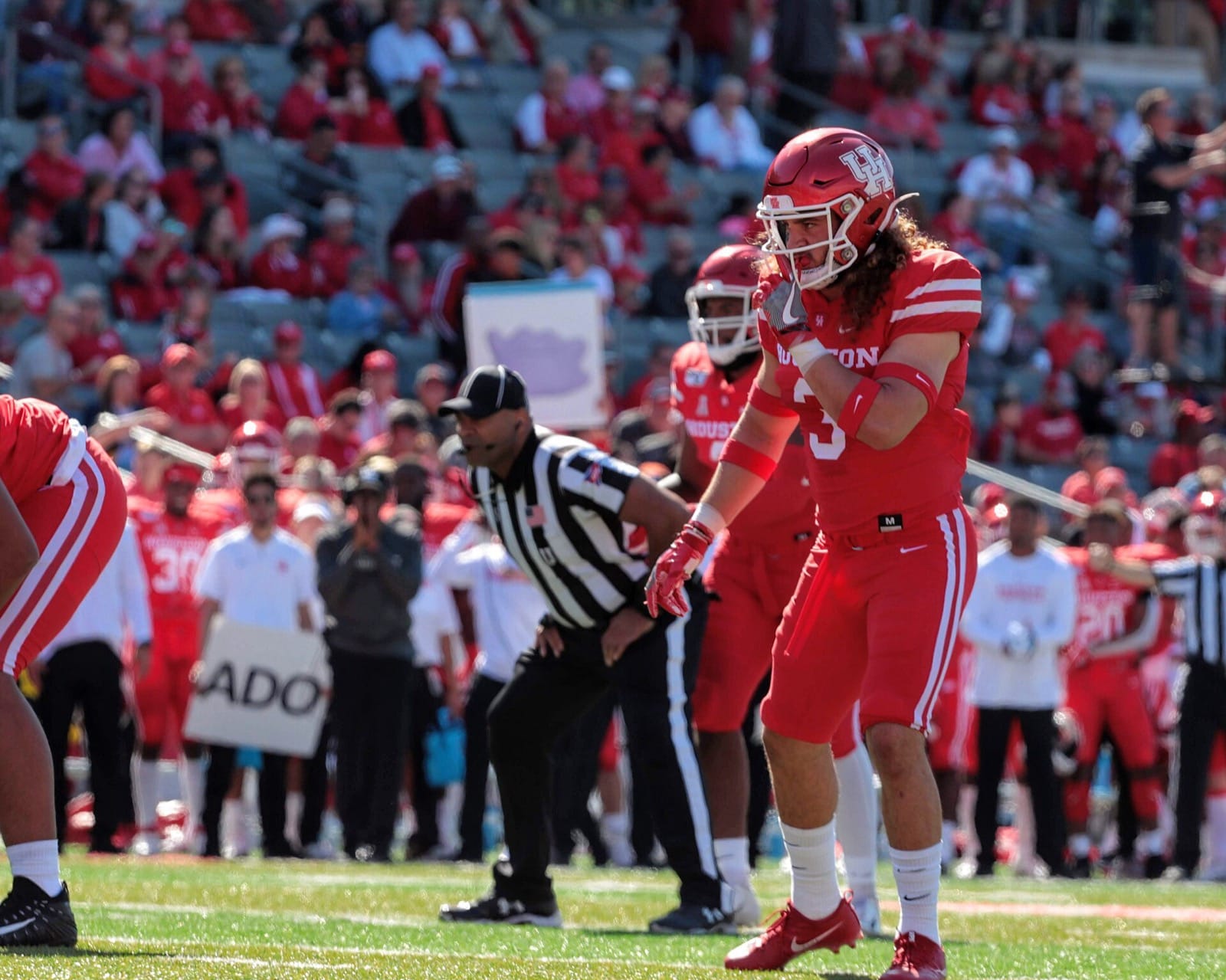 Houston quarterback under center in an all-red uniform against Cincinnati
