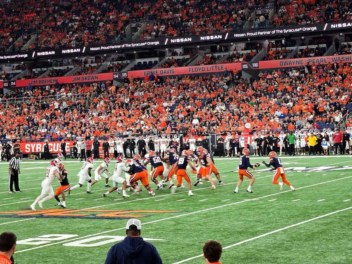 Syracuse's offense hands off against Stanford in front of an orange-clad crowd in the JMA Wireless Dome