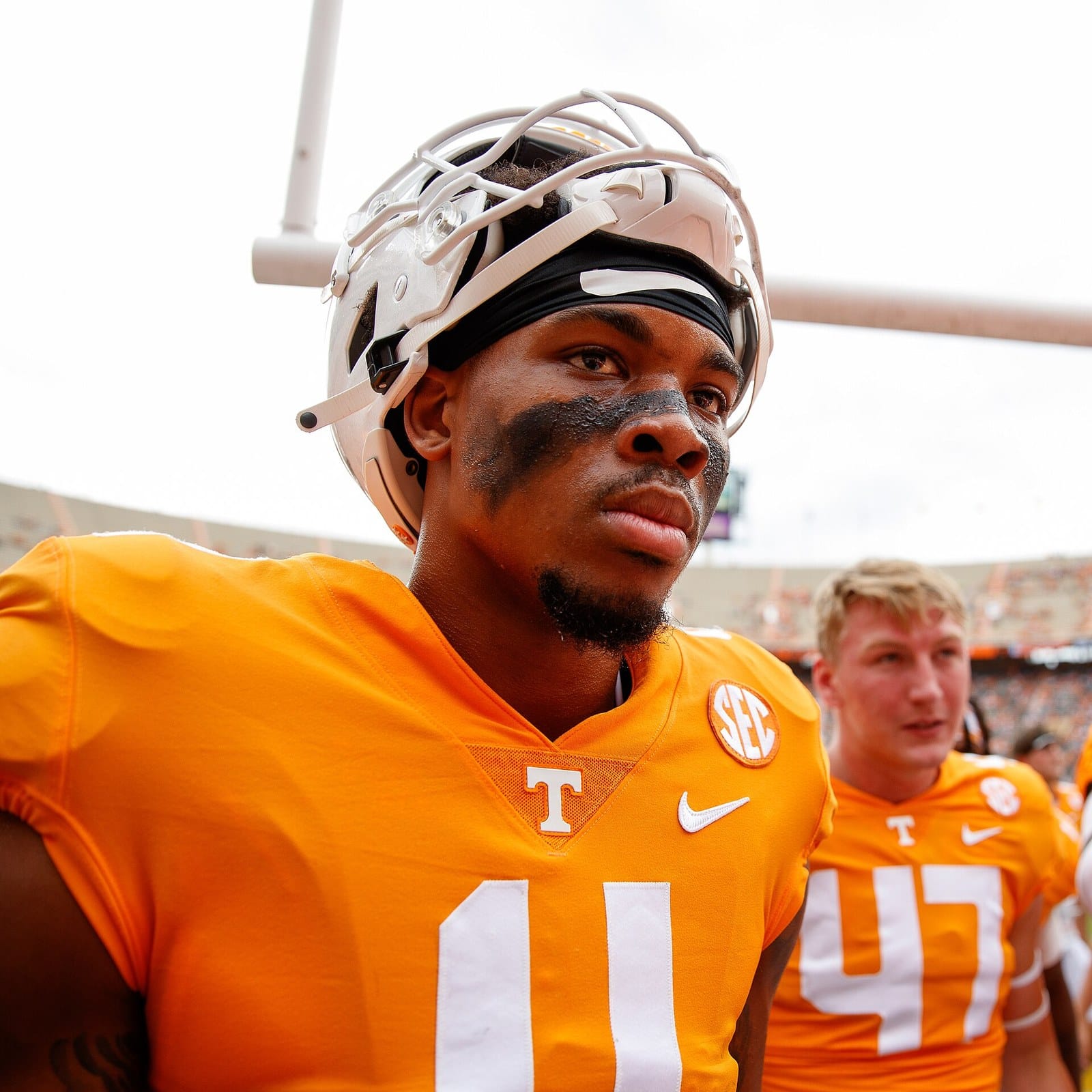 Tennessee wide receiver Cedric Tillman in the orange home jersey and white helmet on the sideline at Neyland Stadium