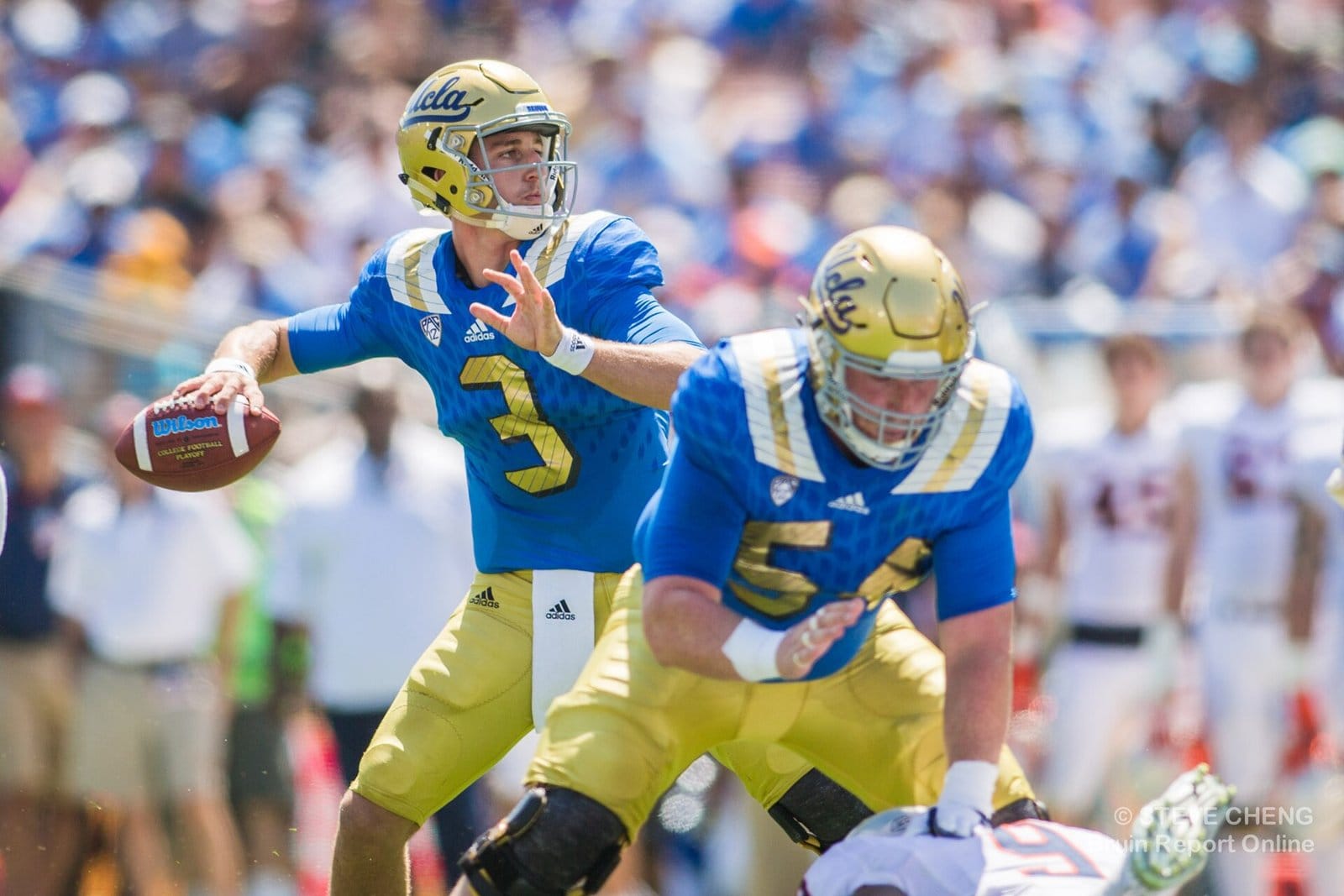 UCLA quarterback takes the snap in the powder blue home jersey and gold helmet at the Rose Bowl