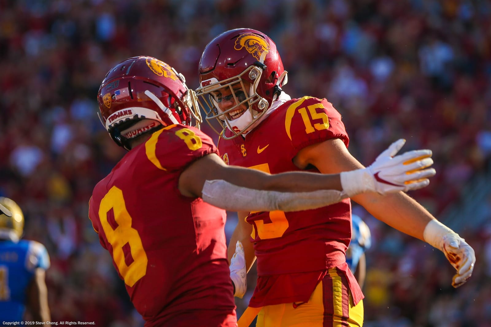 USC receivers Amon-Ra St. Brown and Drake London celebrate in cardinal home jerseys at the Coliseum