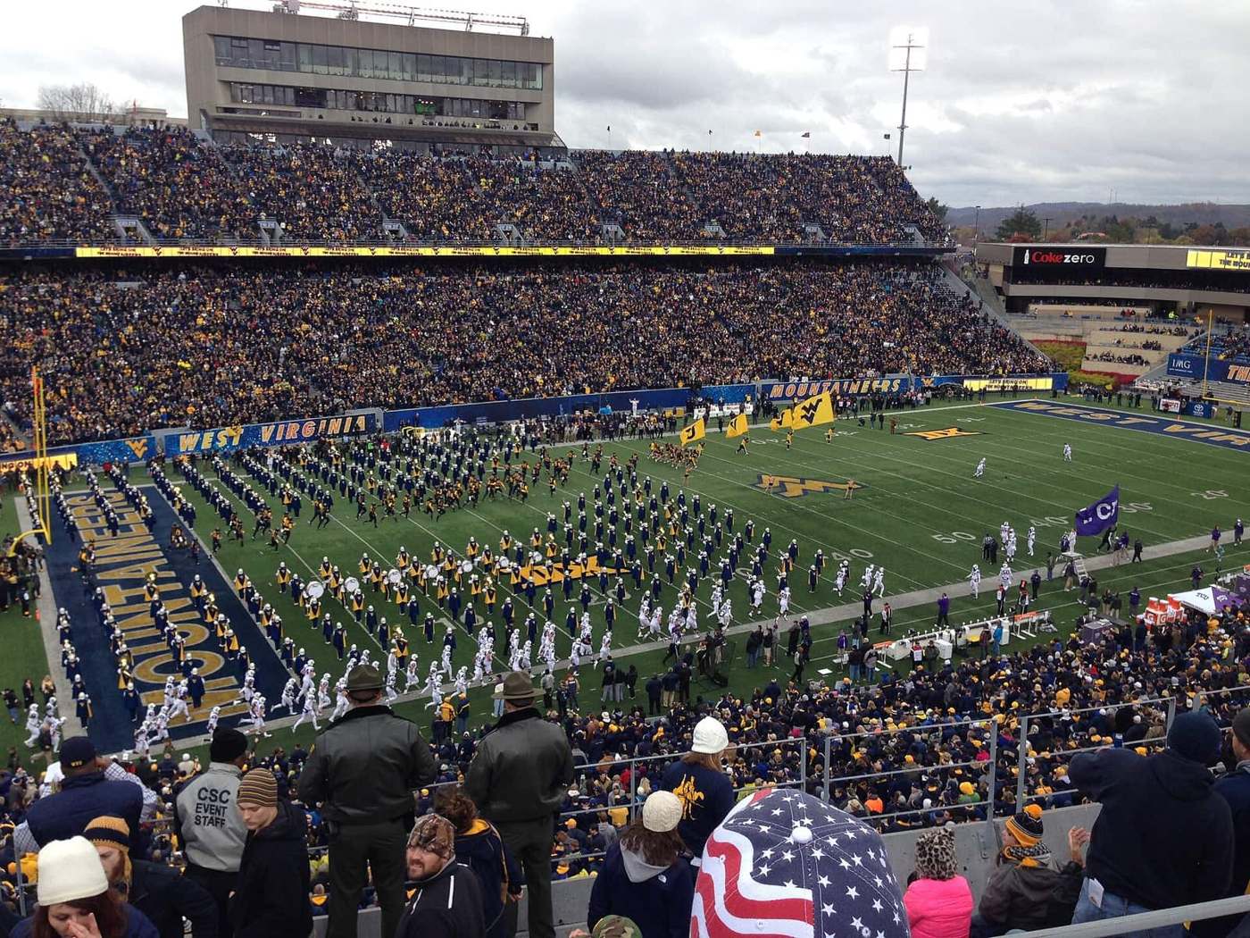 West Virginia players run onto the field before a game against TCU at Milan Puskar Stadium