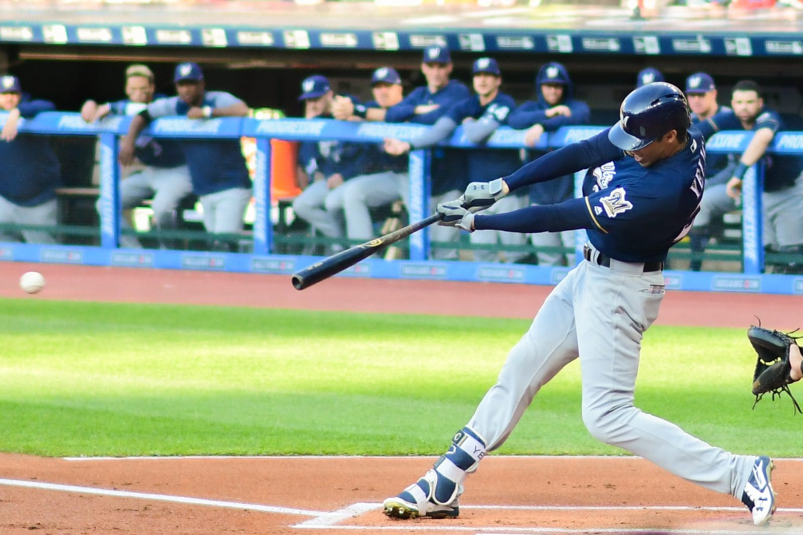Christian Yelich swings in the Brewers' navy alternate jersey with gray pants