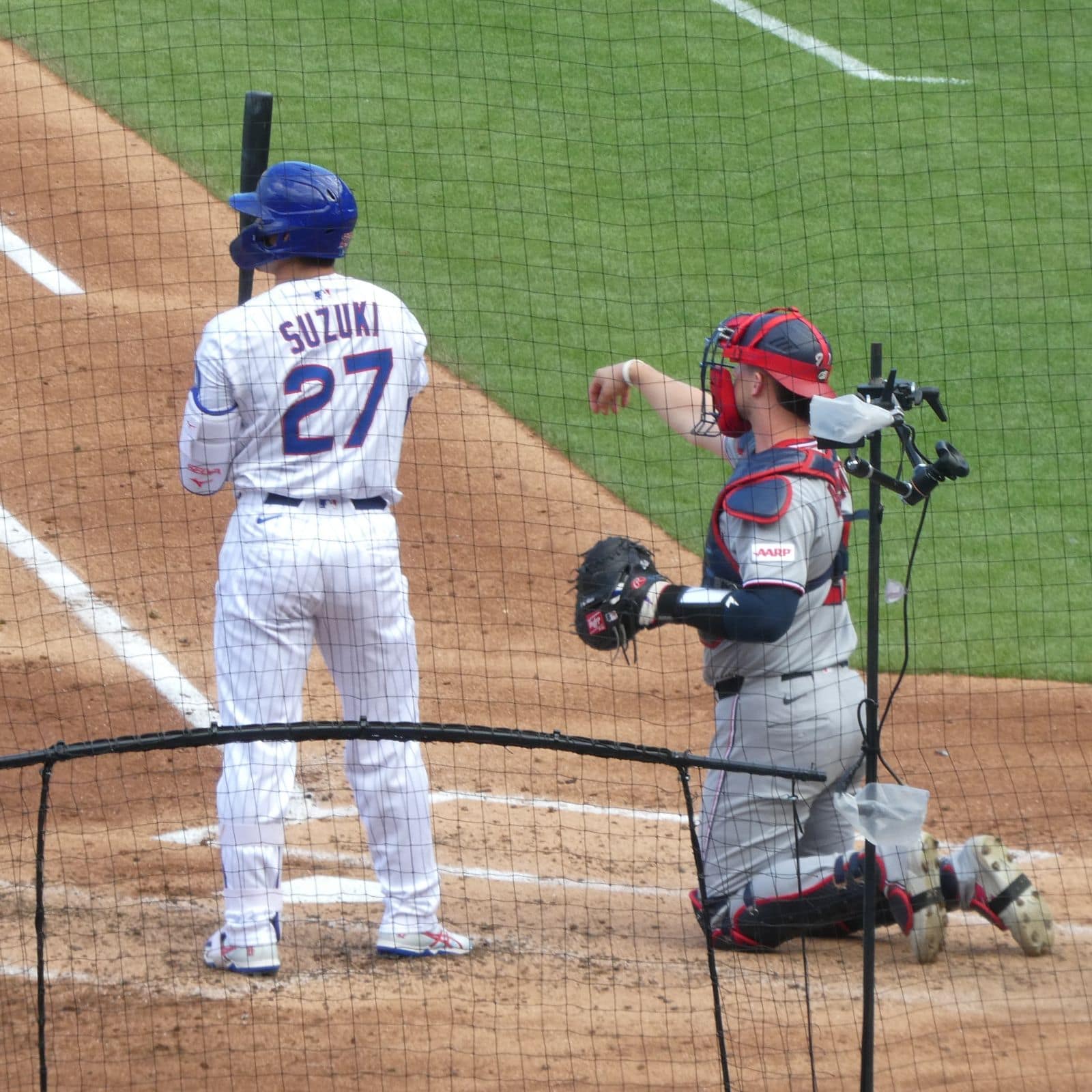 Seiya Suzuki at bat in the Cubs' home pinstripes at Wrigley Field