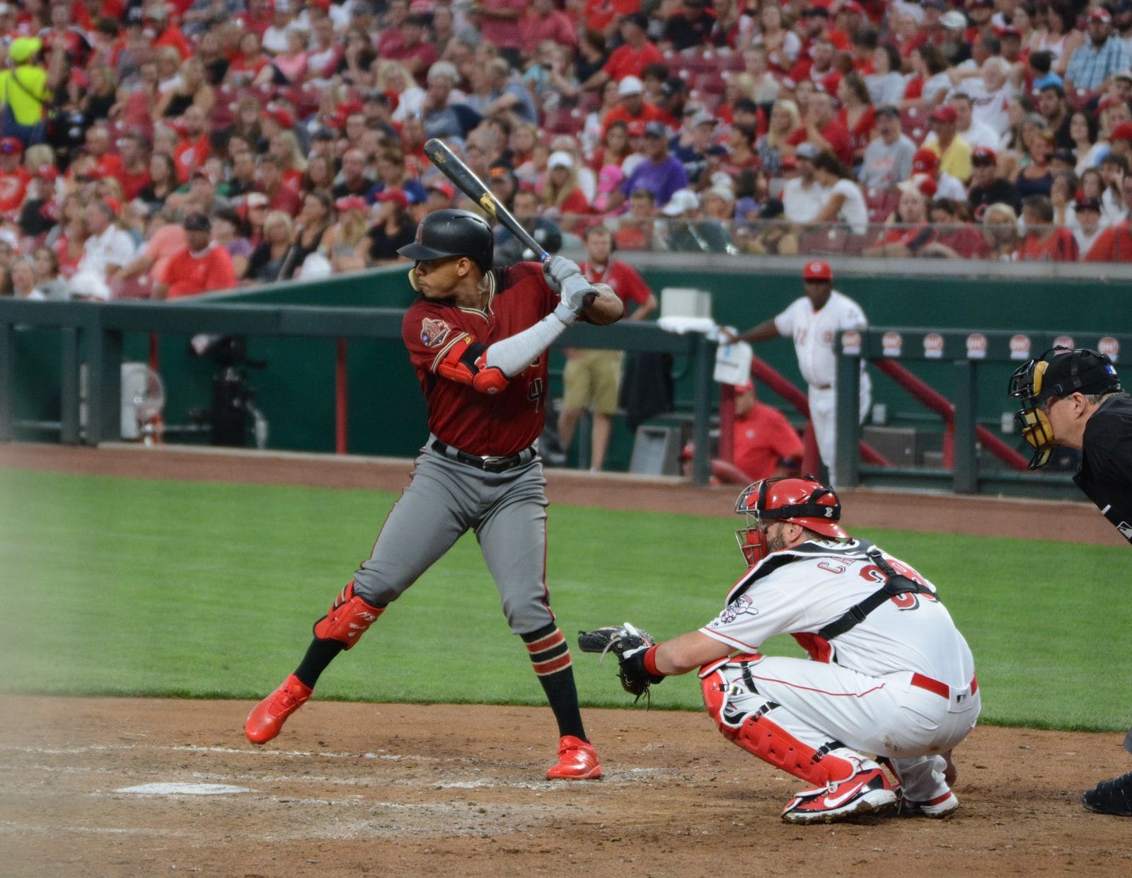 Ketel Marte at bat in the Diamondbacks' Sedona red alternate jersey and gray pants