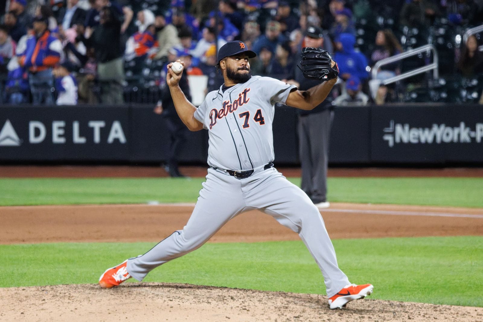 Kenley Jansen pitches in the Tigers' gray road uniform with orange-trimmed Detroit script