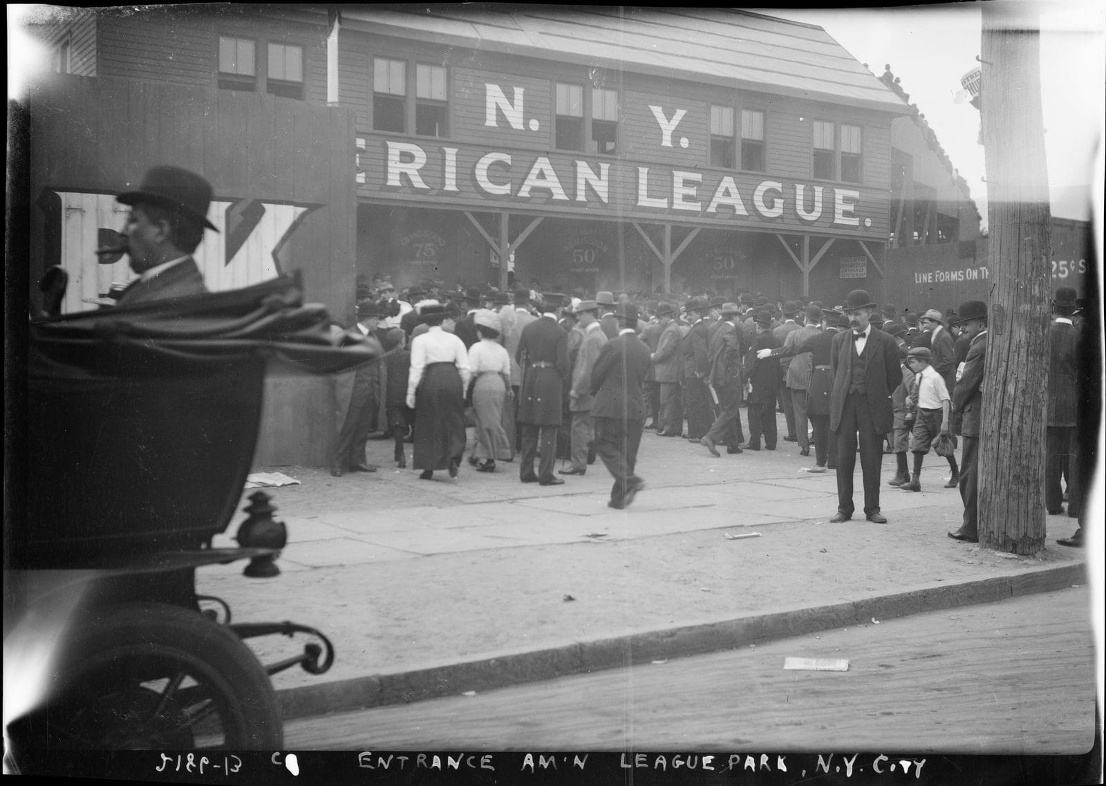 Crowds outside Hilltop Park, home of the New York Highlanders, under a sign reading N.Y. American League, about 1912