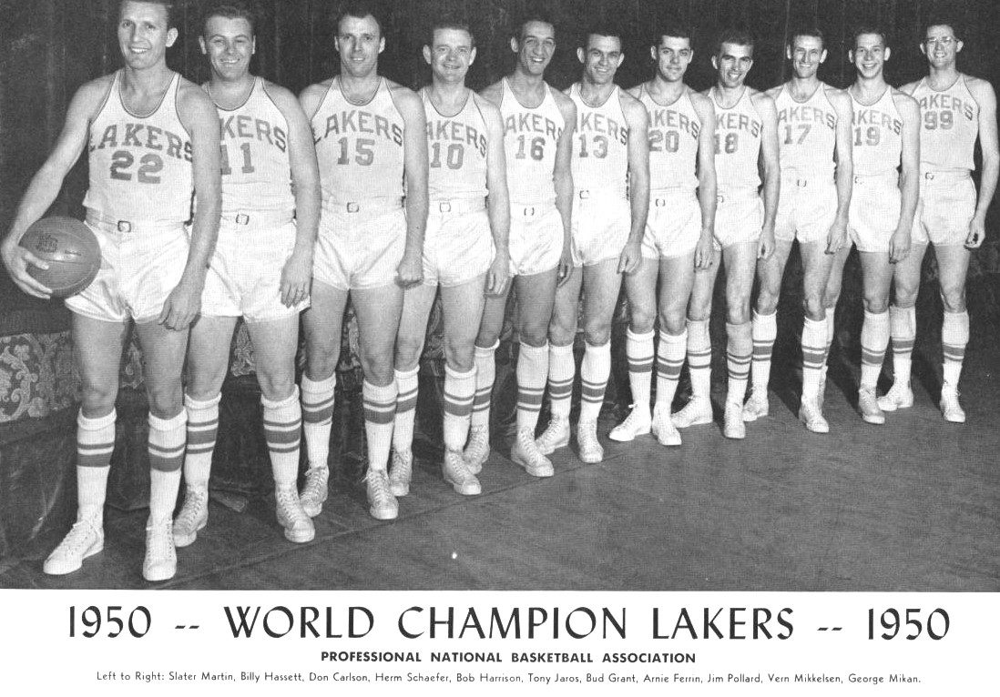The 1950 world champion Minneapolis Lakers pose in white LAKERS uniforms, George Mikan (No. 99) at the end of the row; caption lists Slater Martin, Billy Hassett, Don Carlson, Herm Schaefer, Bob Harrison, Tony Jaros, Bud Grant, Arnie Ferrin, Jim Pollard, Vern Mikkelsen, George Mikan