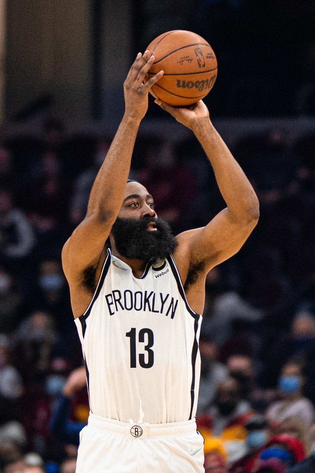 James Harden shoots in the Nets' white uniform with BROOKLYN across the chest and No. 13, at Rocket Mortgage FieldHouse, January 17, 2022
