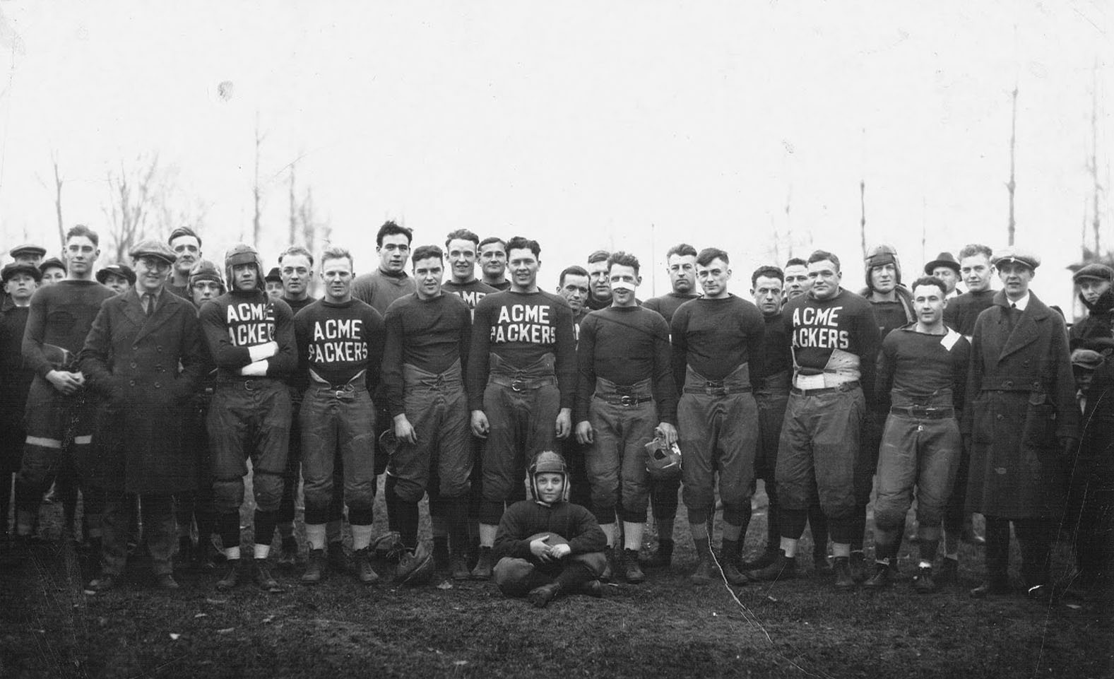 The 1921 Green Bay Packers, the club's first NFL season, in dark jerseys reading ACME PACKERS (black-and-white photo)